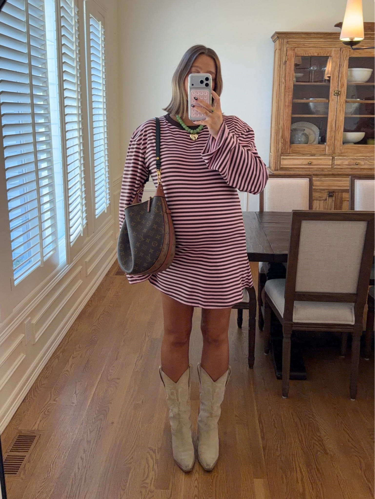 Dress restocked 💓💓size 10 I’m 5’ 5” and it’s such a perfect length!! If I wasn’t pregnant I would do an 8. Stick with true size. Boots true to size probably my most worn cowboy boots ever!! Amazon necklace for a pop of color 

#pregnancystyle #bumpstyle #stripeddress #bresheppard #princesspolly