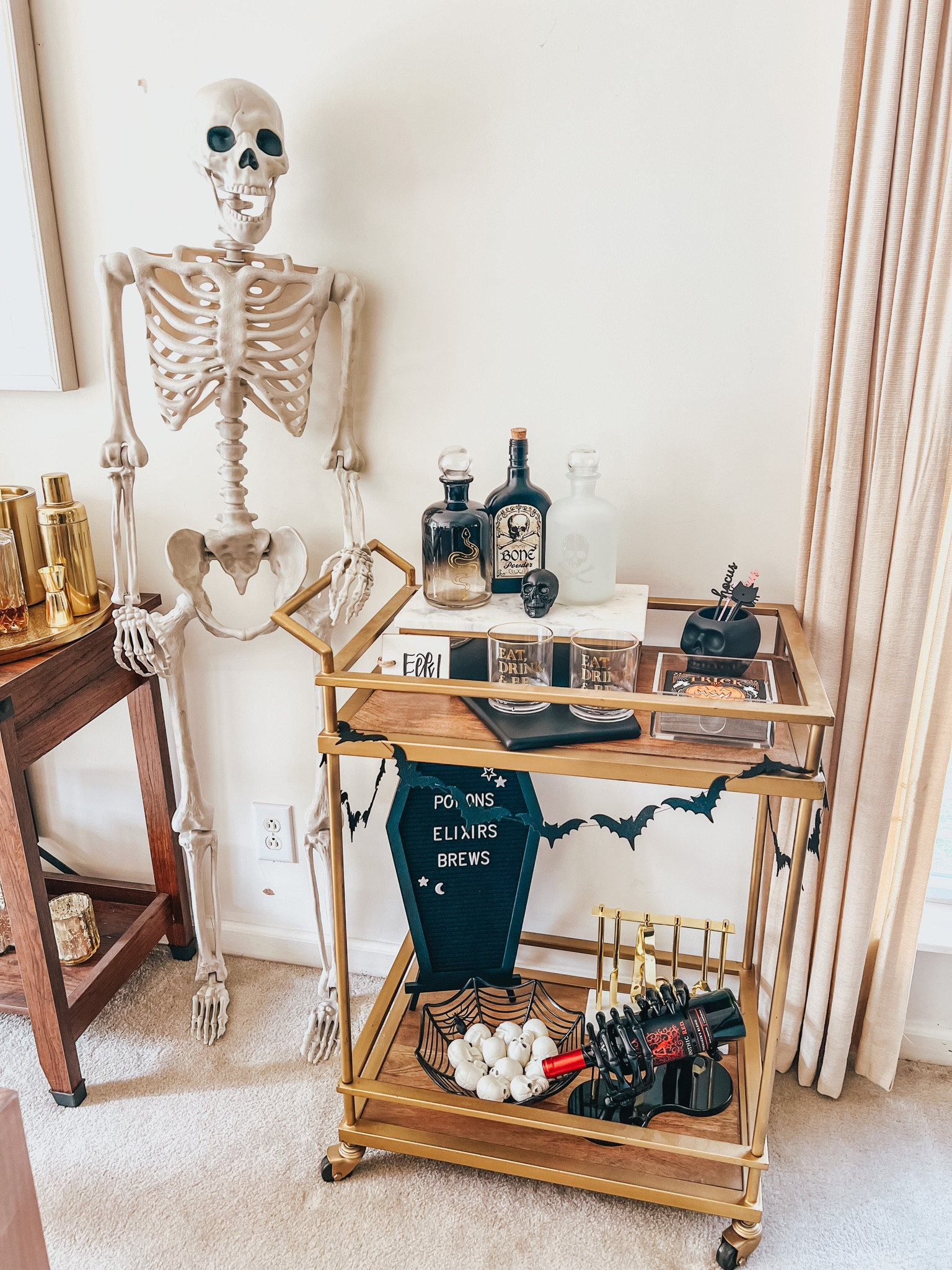 Halloween bar cart 

Skeleton | Halloween party | hosting ideas | beverage station | spooky style | trays | platters | cups 



#LTKhome #LTKHalloween #LTKSeasonal