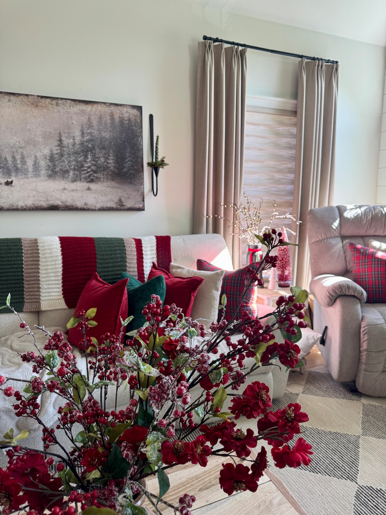 Large winter print, candle wall sconces, taper candles, candle rings, red berry stems and florals, plaid pillow covers, pretty knit throw, area rug  

#LTKHoliday #LTKHome #LTKFindsUnder50