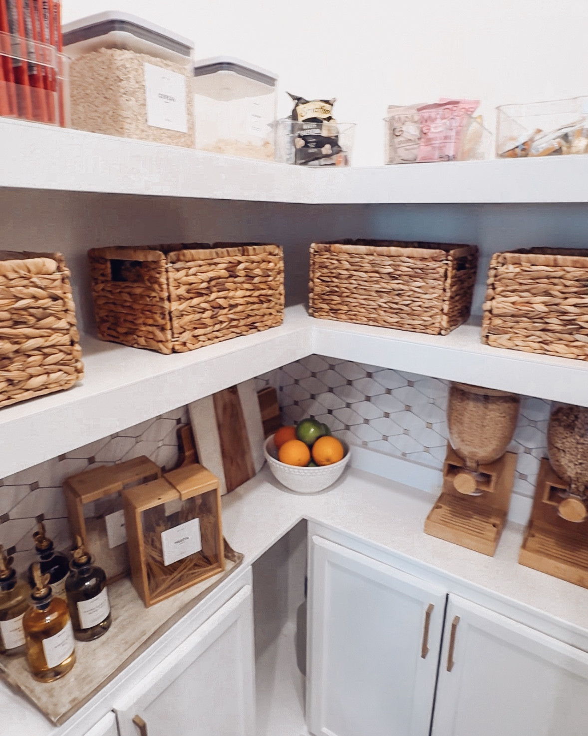 Pantry Organization 

I gathered a variety of organizers to pull everything together: can organizers for the cabinets, cereal dispensers, oil pourers, food storage dispensers for rice and pasta, wicker baskets, a wrap organizer with a cutter, and labels for plastic wrap, aluminum foil, and wax paper, along with bamboo dispensers and hooks for the kids’ lunch boxes. To finish it off, I added champagne gold hardware to the cabinet doors for a touch of elegance.

#LTKHome