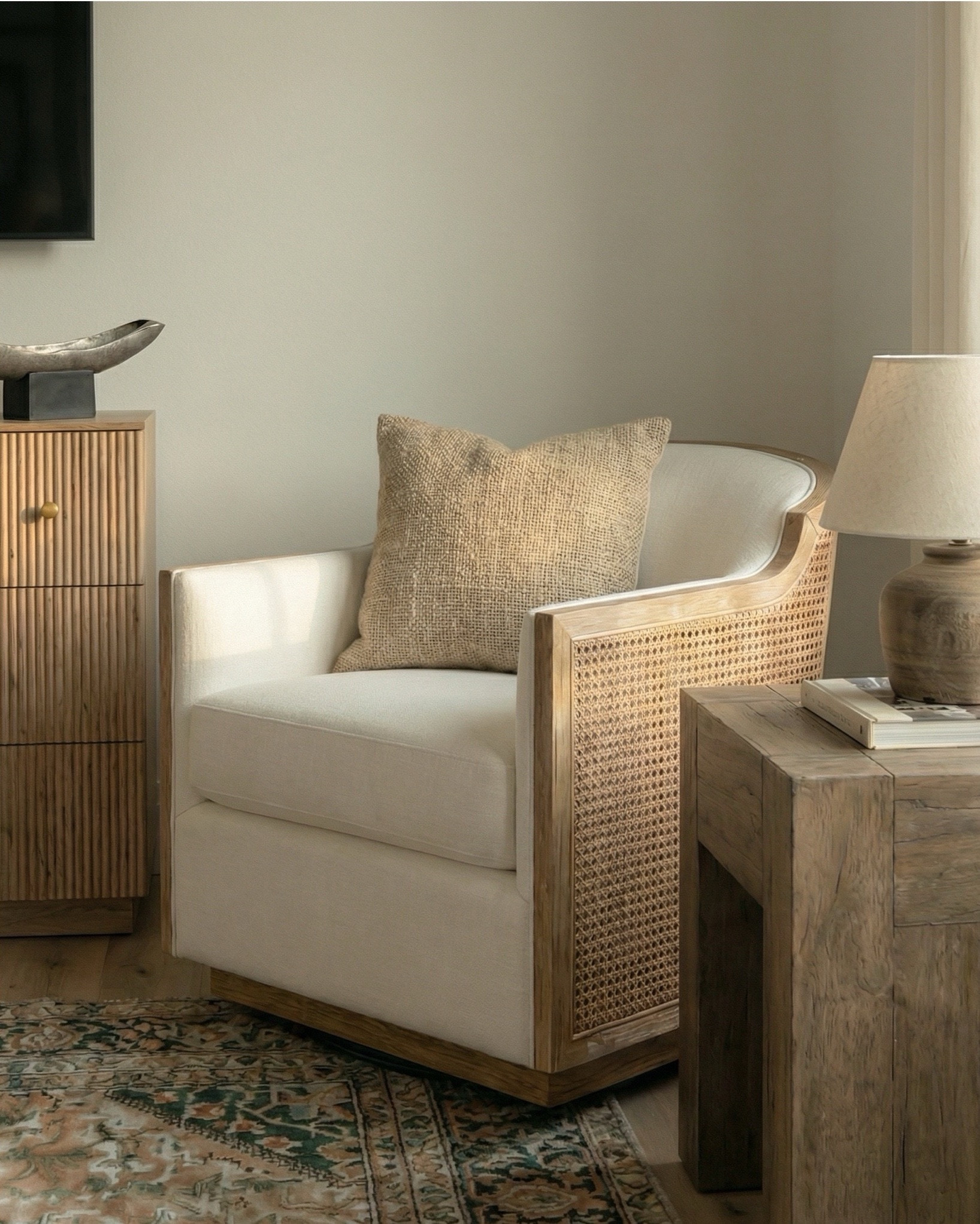 Shop the look:
* Wood canopy bed 
* Brown leather upholstered bench
* Brown knitted blanket
* Brown throw pillows
* Brown wood 3 drawer nightstands
* Wall art
* Glove wall lights
* White tree planter
* Black vase
* Black table lamp
* White decor bowl
* Decor books
* Wood dresser
* Brown traditional rug 
* Wood decor beads
* Wood upholstered swivel chair
* Wood end table
* Green runner rug 
* Faux olive tree

#LTKsale #LTKhome #LTKstyletip