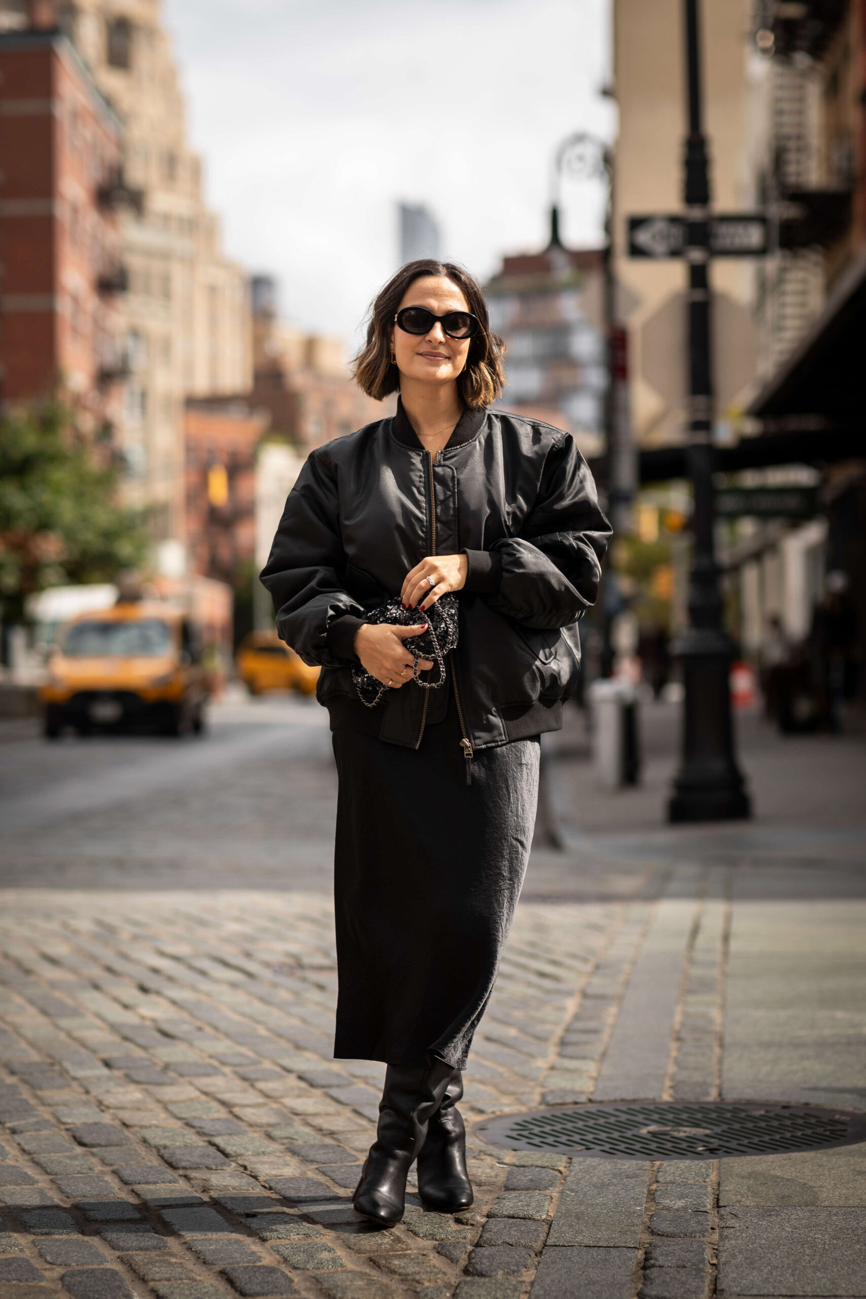 An easy way to carry a simple black dress into fall: layer on an oversized bomber jacket and add tall boots. I love how the different textures give this monochromatic outfit a little more dimension while still keeping everything sleek and effortless.  

 #LTKootd #LTKSeasonal