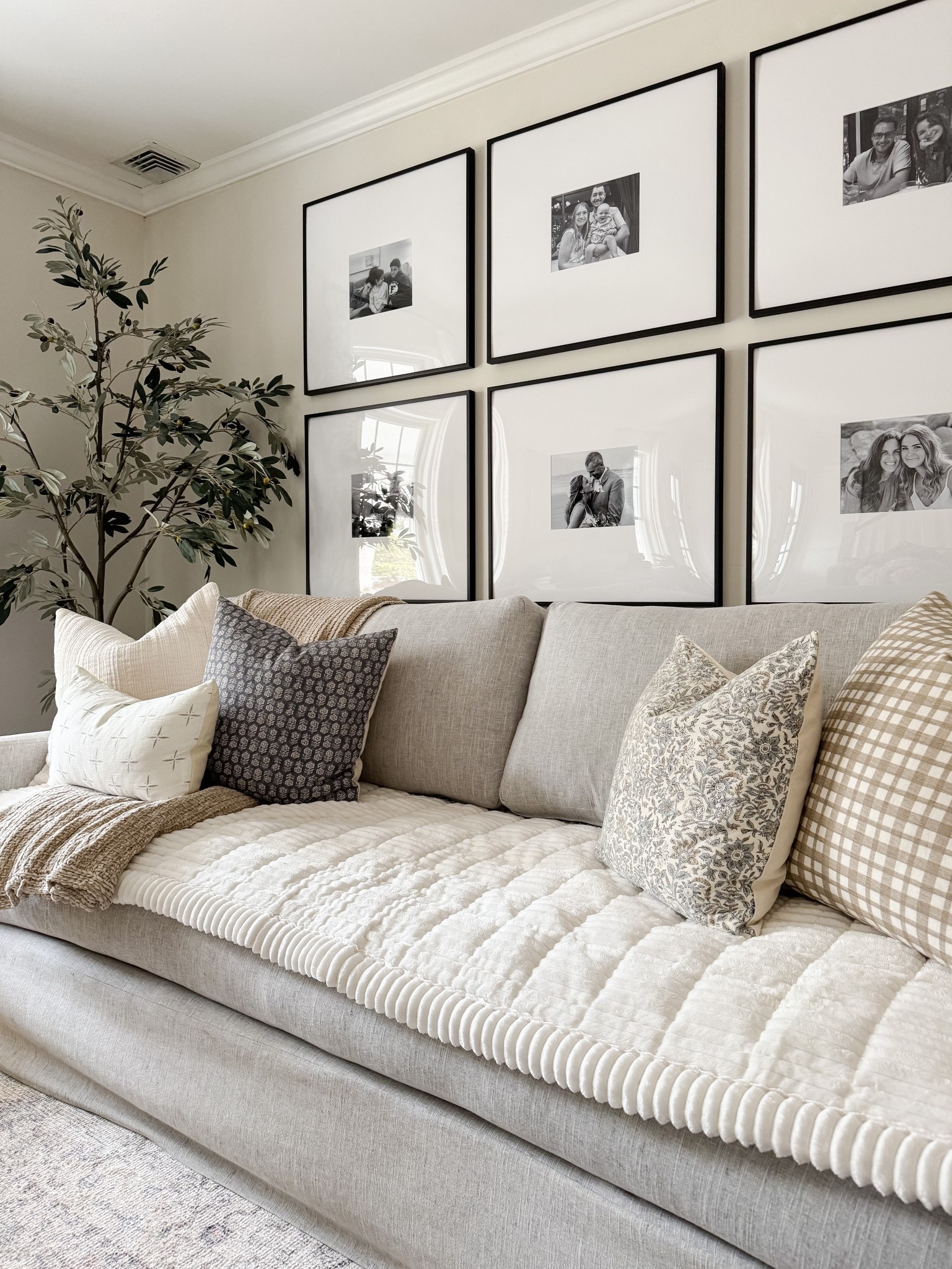 Living room decor ideas 🤍 Loving these finds for year-round display! Timeless, classic, and at various price points! Sofa cover, gallery frames, throw pillows, faux olive tree 

#LTKHome