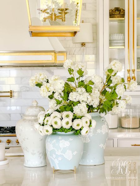I love these white snowballs and ranunculus for spring and summer decor. There are 6 snowballs in the ball blue ginger jar and 15 ranunculus in the small blue ginger jar. Use the gold stand from the marble tray to hold your ginger jar. Use the marble base as a candle holder  

#LTKFindsUnder50 #LTKHome #LTKStyleTip
