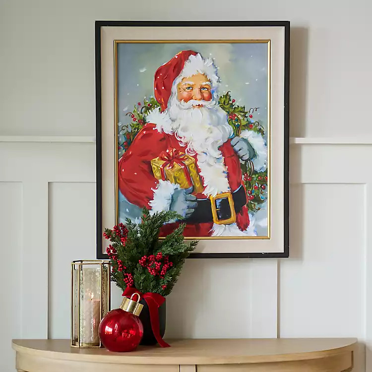 New! Holly Santa with Gift Framed Canvas Art Print | Kirklands