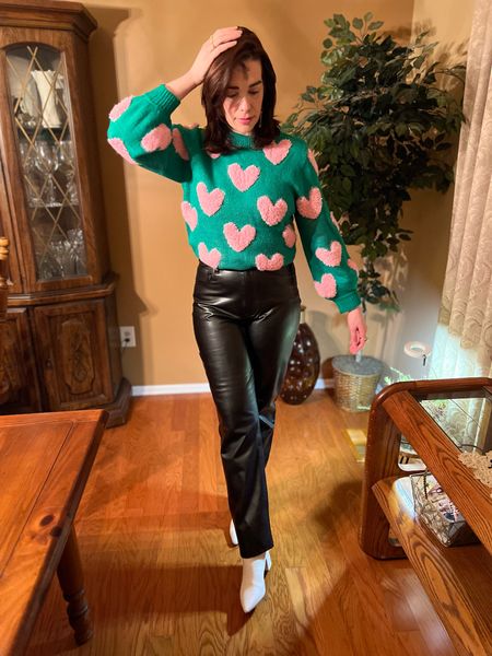 Green and pink heart sweater (size small). Black leather straight leg pants (size 27). White boots (size 8.5). #heartsweater #greensweater #pants #leatherpants #straightlegpants #boots #whiteboots #valentinesday #winterfashion #winterstyle #valentinesdayoutfit 
Valentine’s Day Outfit 

#LTKstyletip #LTKSeasonal #LTKfindsunder100