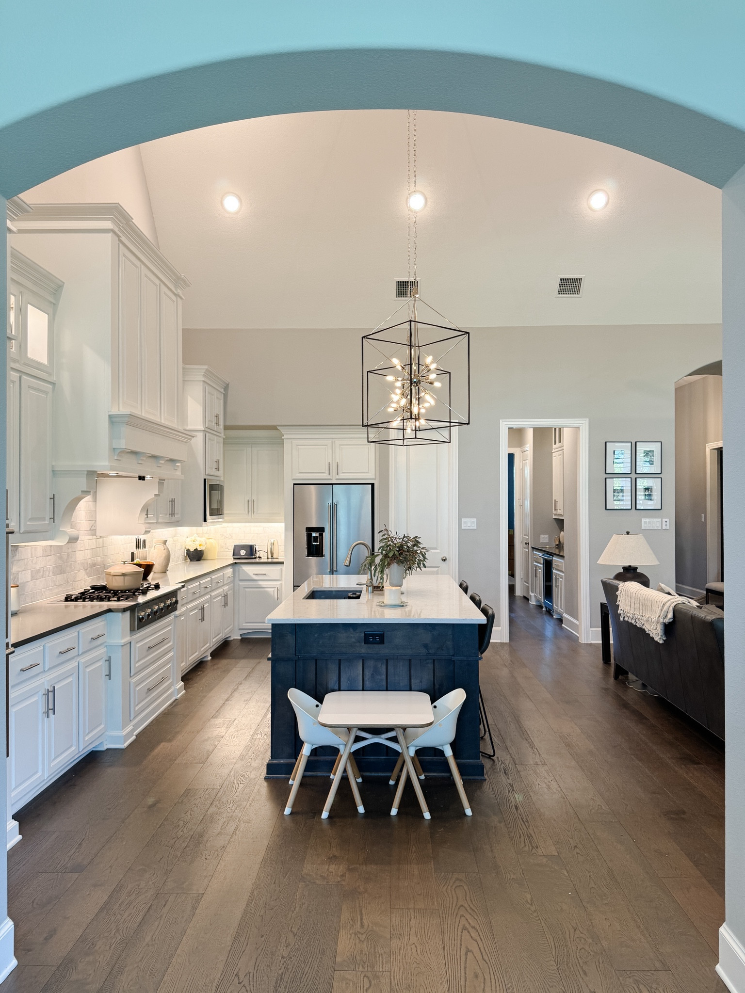 Toddler table in kitchen, two toned kitchen, modern kitchen lighting, quartz counters 

#LTKFamily #LTKHome #LTKKids