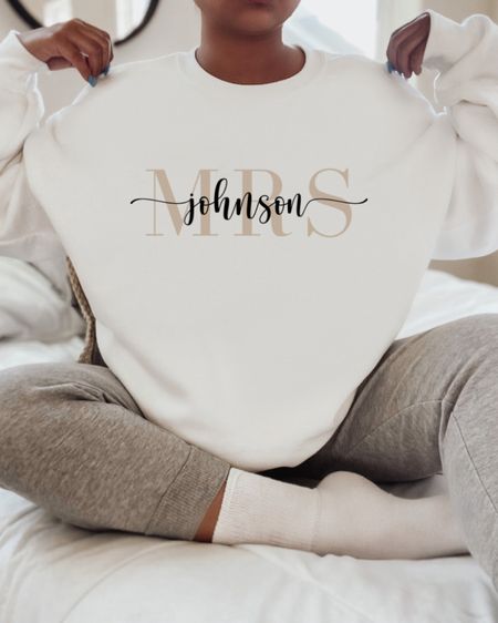 Custom Bride Sweatshirt (Mrs. YourNameHere)!! S-5XL! 🤍 The perfect gift for Valentines Day 💍 Click below to shop ✨ Follow me for daily finds!! ☁️ #wedding #bride #engagement #valentine #valentinesday #giftsforher #fiance #bridetobe 
Engagement gift, engagement shirt, bride sweatshirt, wifey sweatshirt, bride to be, bride to be gift, bachelorette party, bride sweatshirt outfit, bride sweater wedding, bride sweatshirt bachelorette parties, bride sweater sweatshirts, wedding ideas, wedding announcement, engagement party ideas, engagement photos outfit, engagement party, engagement rings, future mrs, future bride, future bride gifts, future bride shirt, future bride shirt ideas, wedding ideas, gifts for bride, gifts for fiancé, Valentine’s Day, Valentine, gifts for her, anniversary, anniversary gifts, gifts for fiancé, bride to be gifts, dress, travel, wedding outfits, wedding guest, wedding guest gifts, wedding guest dress, wedding guest outfit 

#LTKGiftGuide #LTKFind #LTKwedding #LTKstyletip #LTKU #LTKunder50 #LTKunder100 #LTKfamily #LTKmens #LTKSale #LTKsalealert #LTKcurves