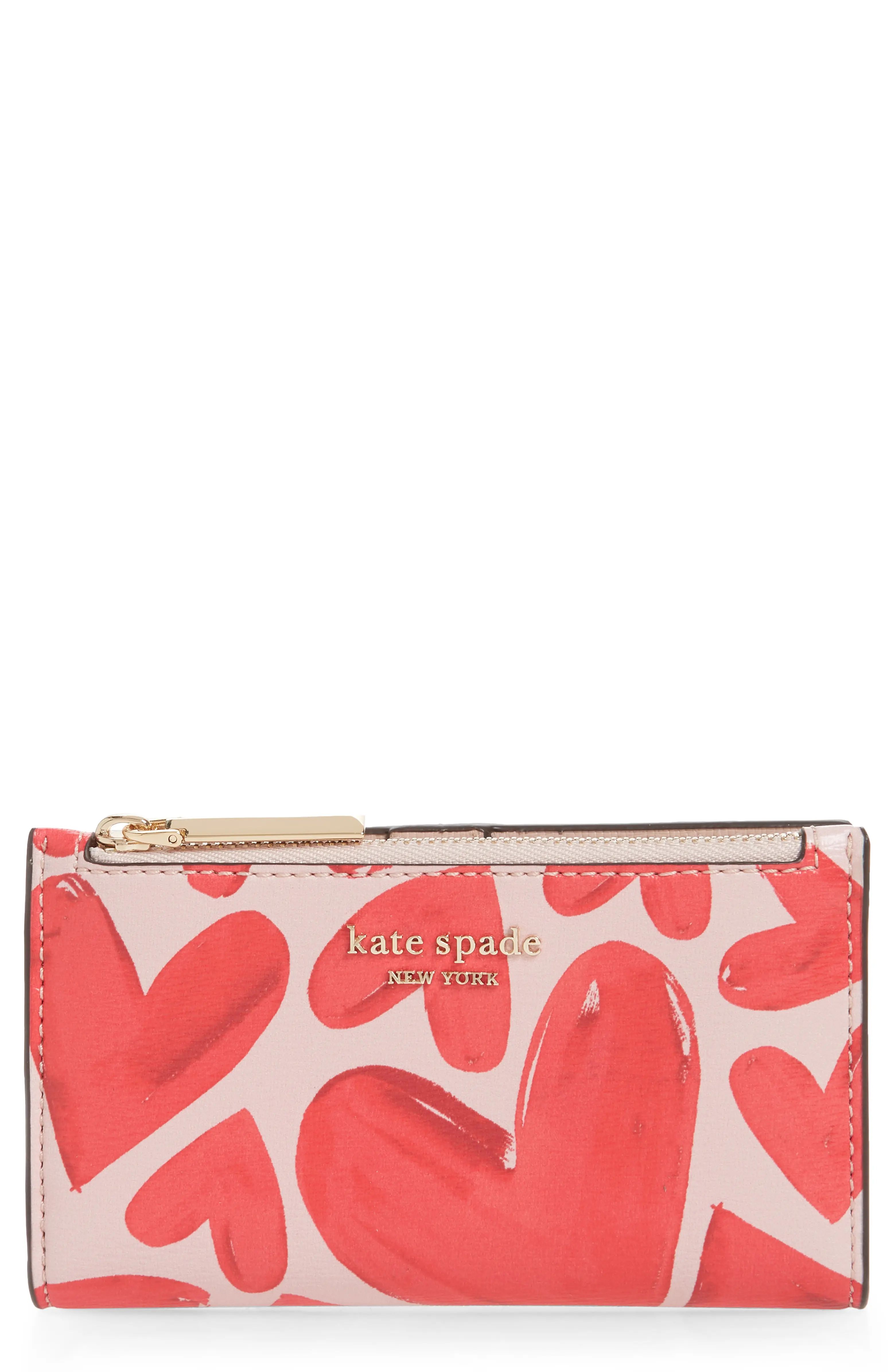 Small in scale but not in capacity, this chic bifold wallet works in a wink with a zip pull style... | Nordstrom