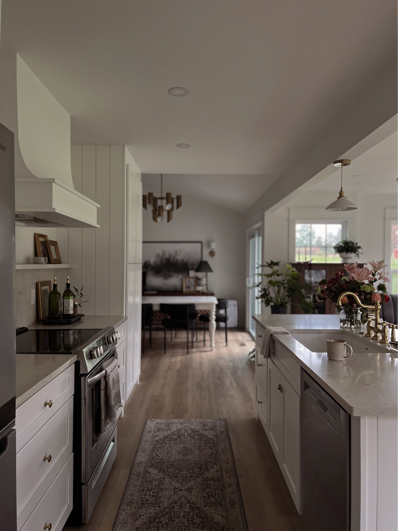 Step into our enchanting cottagecore-inspired kitchen, where organic simplicity meets modern beauty. This cozy haven is adorned with English cottage-inspired details, embodying the essence of #CottagecoreLiving. From the warm glow of the vintage pendant lights to the connection around the kitchen island, our kitchen exudes a feeling of nostalgia and warmth. It's the perfect blend of #RusticChic and #HomeSweetHome, a place where we celebrate the simple pleasures of life. #KitchenAesthetics #CountryLiving #CottagecoreKitchen 

#LTKhome #LTKsalealert