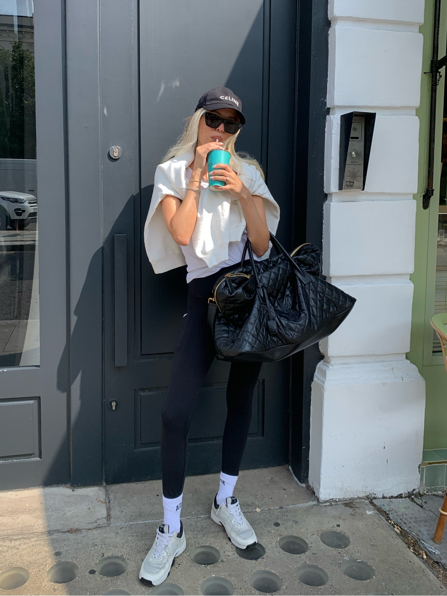 pilates princess out with oversized  YSL shopper, celine cap 🤍 
