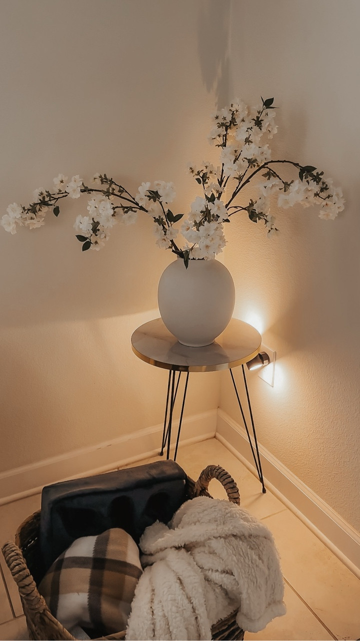 Spring isn’t about buying more.
It’s about styling smarter 🤍🤎

This little warm glow completely transformed this corner of my living room.
Adjustable brightness. Soft ambient light. Effortless chic.

Sometimes the smallest details make the biggest difference.

Comment SHOP and I’ll send you everything I used ✨
(table, vase, cherry blossoms + spotlight)

#AmazonFinds but make it elevated.

#LTKHome #LTKSeasonal #LTKSpringSale