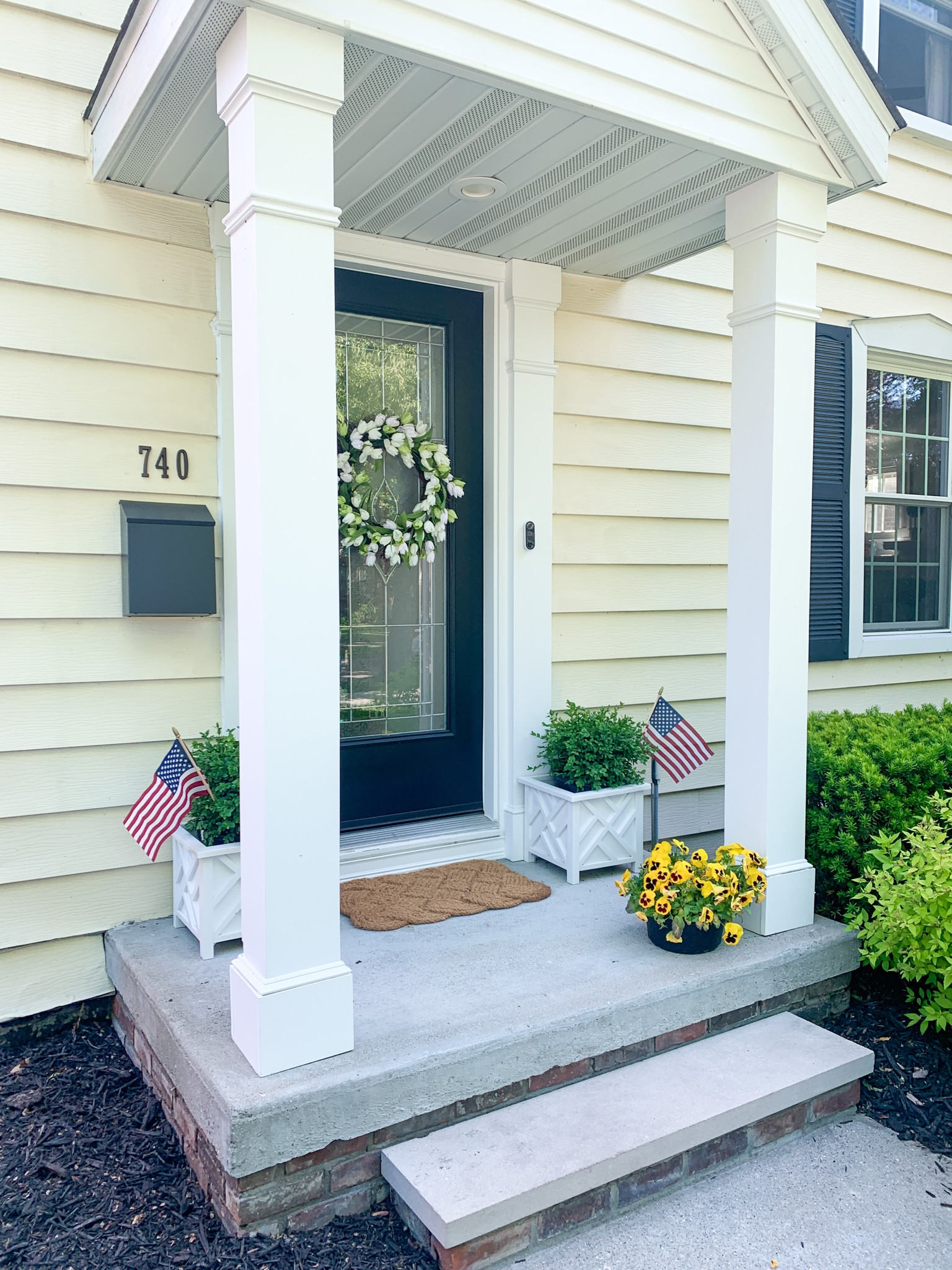 Black mailbox, house numbers, tulip wreath, curb appeal, planters 

#LTKhome