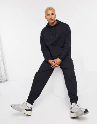 ASOS DESIGN organic tracksuit with oversized hoodie & oversized joggers in black | ASOS (Global)
