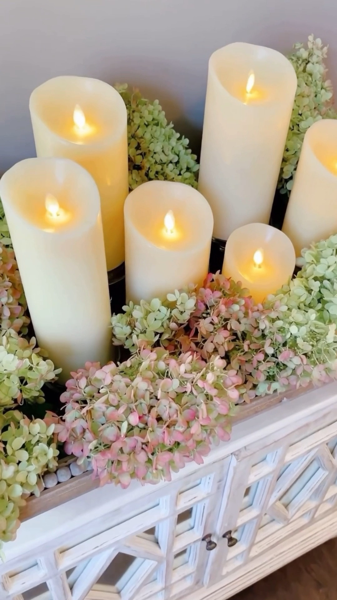 Dried Limelight Candle Garden 🤍 one of my favorite ways to enjoy Limelight hydrangeas long after they’ve bloomed. Preserve their beautiful color and texture by pairing dried blooms with flameless candles in a shallow vessel for an effortless late-summer centerpiece.

It’s an easy way to bring the beauty of the garden indoors with timeless elegance.

#LTKSeasonal #LTKHome