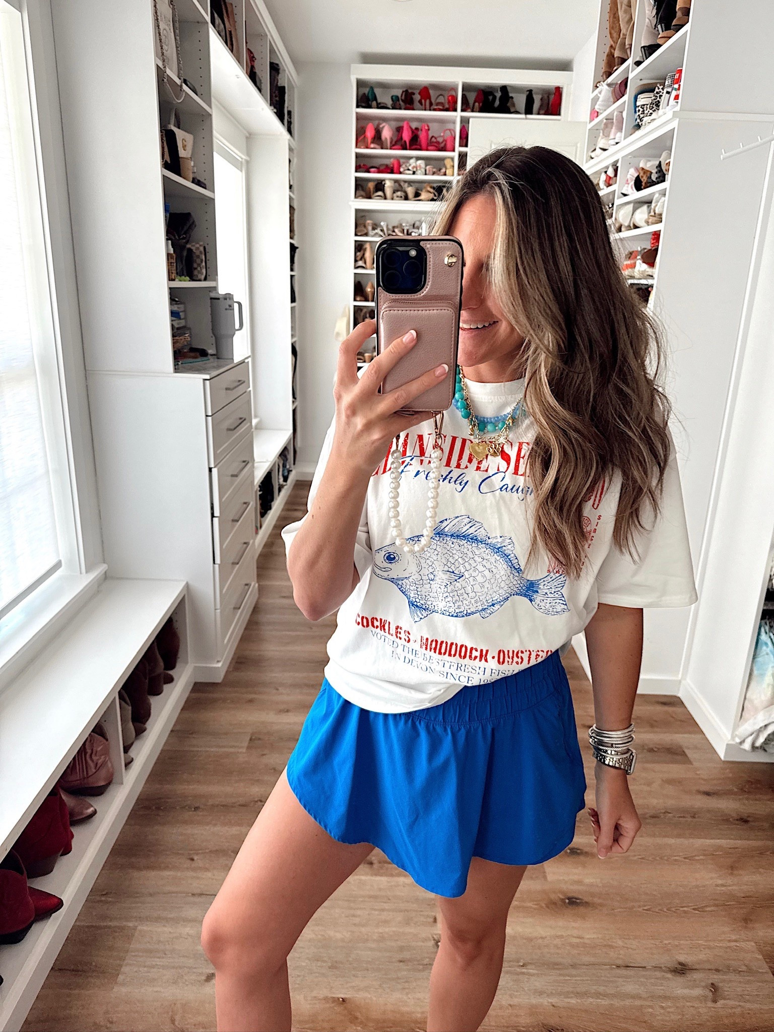 In a large graphic tee, large athletic skort and accessories - fits tts.

#LTKFindsUnder50 #LTKSeasonal #LTKStyleTip