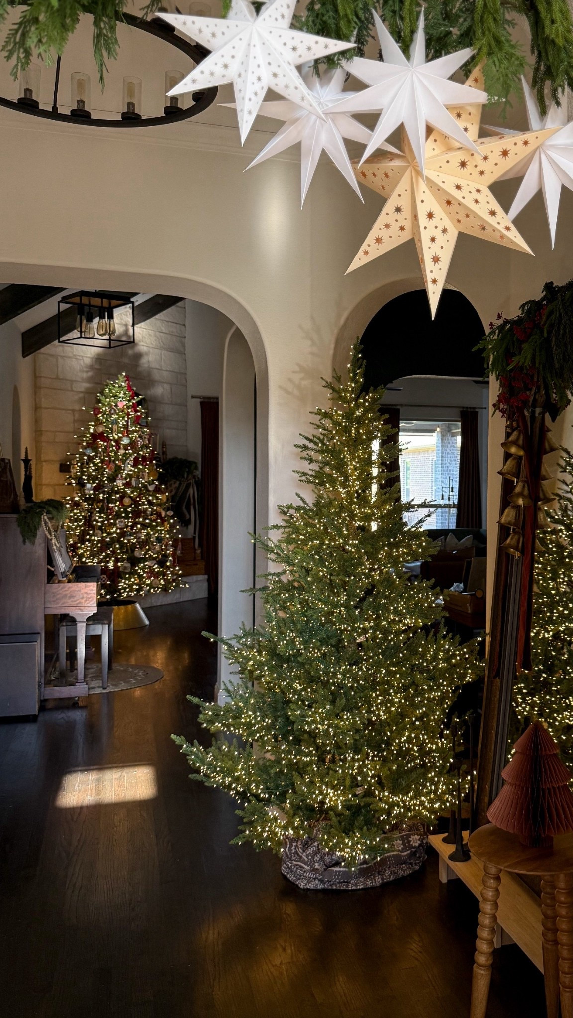 Christmas entryway inspo, christmas trees, bells, wood houses for christmas, entryway table, christmas village, mirrors

#LTKHome #LTKHoliday