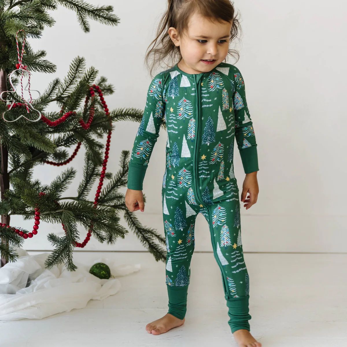 Green Twinkling Trees Bamboo Viscose Zippy | Little Sleepies