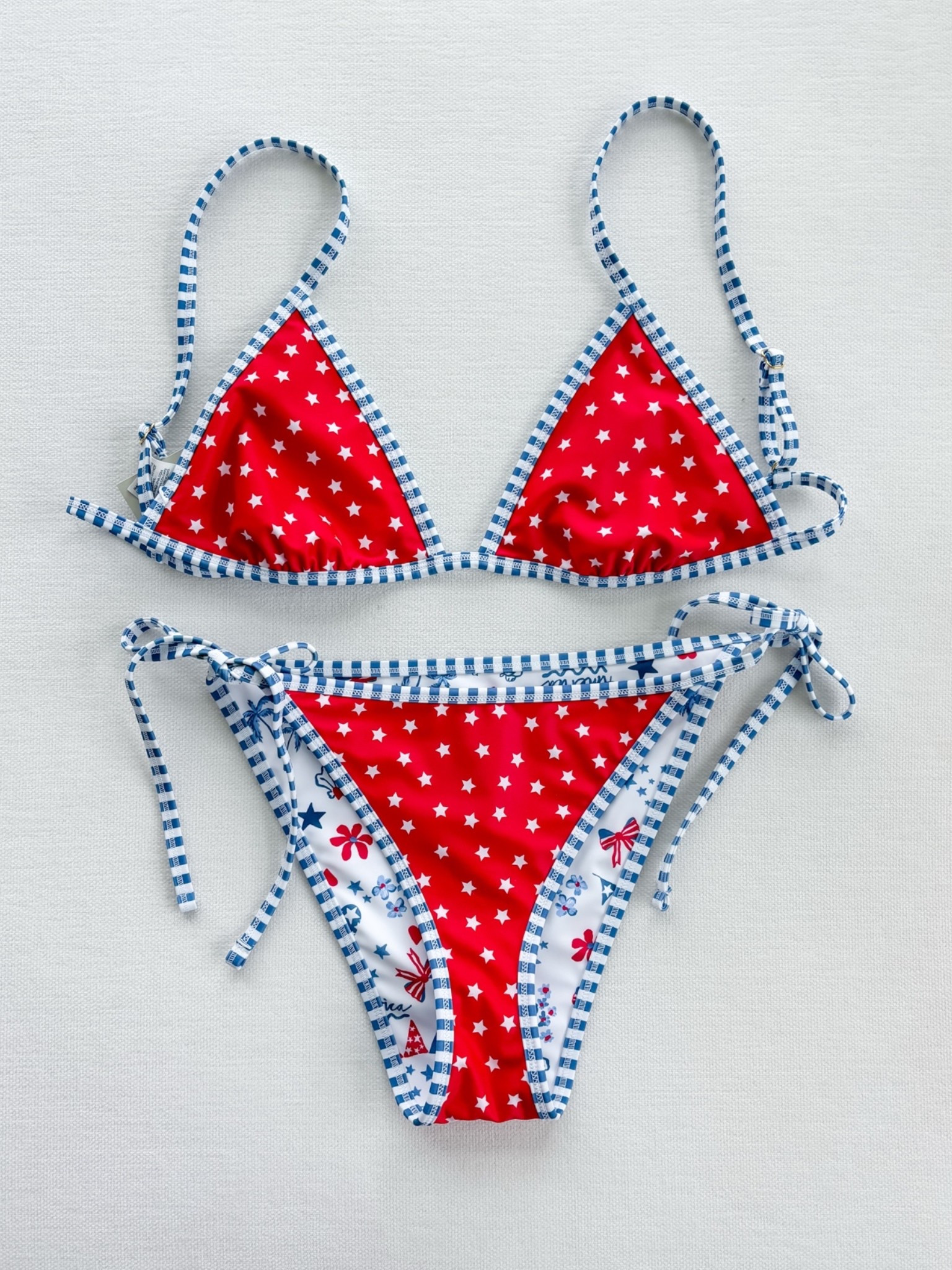 Obsessed with this!!! Got a M in both the top and bottom (I used another Walmart bikini for reference and it fits perfectly)! So perfect for Americana summer and the 4th!!! 

American summer
Americana summer
Patriotic swimsuits 
2026 swimsuits 
Cute cheap swimsuit 
Cute cheap bikini 
Cute swimsuit 
Cute bikini 
Roller rabbit
Roller rabbit dupe 
Stoney clover 
Stoney clover dupe 
Preppy 
Red white and blue 
Walmart find
Americana bikini
American summer bikini
Americana summer bikini 
Americana swim
American flag bikini
Fourth of July bikini
4th of July swimsuit
Patriotic swimwear
USA bikini
Red white and blue bikini
Memorial Day swimsuit
Labor Day swimwear 
Summer patriotic outfit
Coquette bikini
Coastal coquette swimwear
Girly bikini
Cute string bikini
Triangle bikini
Tie side bikini
Vintage Americana
All American girl aesthetic
Cottagecore summer swim
Feminine swimwear
Beach vacation bikini
Summer beach outfit
Pool day bikini
Lake day swimsuit
Boat day outfit
Resort swimwear
Tropical vacation bikini
Beach club outfit
Coastal granddaughter style
Hamptons summer style
Blue and white bikini
Red white blue swimsuit
Star print bikini
Heart print bikini
Gingham trim bikini 
Printed triangle bikini
Cute patriotic print
Preppy swimwear
Americana print swimsuit
Novelty print bikini
Summer 2026 swimwear
Viral bikini
LTK summer finds 
Vacation must haves
Amazon bikini dupe
Designer inspired swimwear
Beach essentials
Summer outfit inspiration
Trending swimwear
Coastal summer style
Cute red white and blue bikini
Patriotic bikini for Fourth of July
Coquette Americana swimsuit
Preppy patriotic swimwear
String bikini with tie sides
Coastal cowgirl beach outfit
Hamptons inspired swimwear
Old money beach aesthetic
Americana beach girl style
Fourth of July pool party outfit

#LTKSwim #LTKTravel #LTKSeasonal