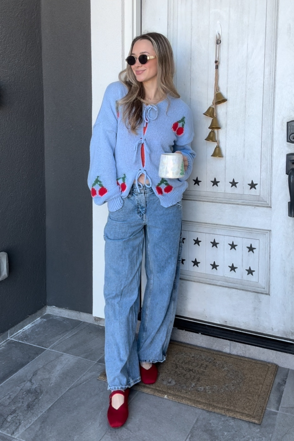 Cherry front tie sweater with baggy mid rise jeans and Mary Jane flats 

#LTKShoeCrush #LTKHoliday #LTKStyleTip