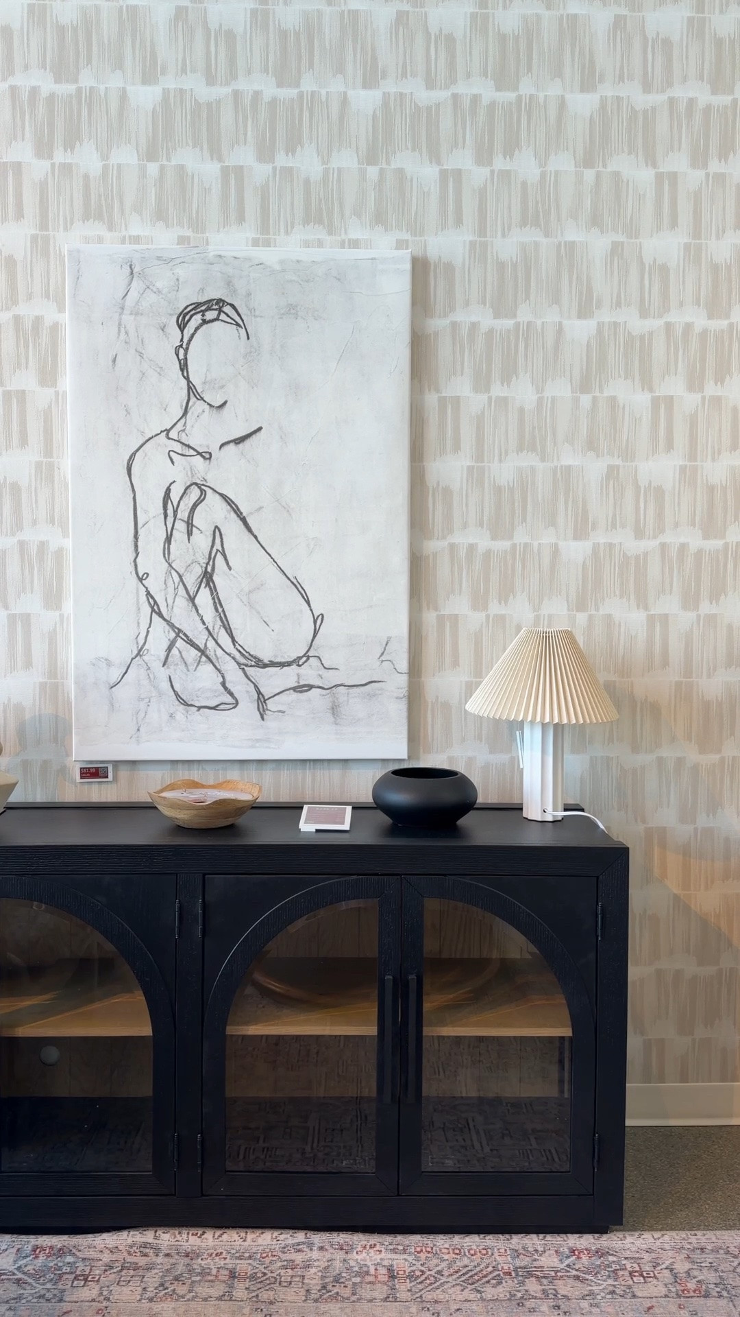 Modern glam living room inspiration from Wayfair! 🤩  This black arched wood and glass console looks so chic styled against statement wallpaper with layered artwork and decorative accents.🖤 I love the contrast between the neutral patterned backdrop and sleek black furniture—it gives the entire space such a refined, designer-inspired look. 👀 I’ve linked the whole setup and similar Wayfair finds in my LTK! 💫 @Wayfair #mediaconsole #entrywayinspo #wayfairfind

#LTKHome #LTKSaleAlert
