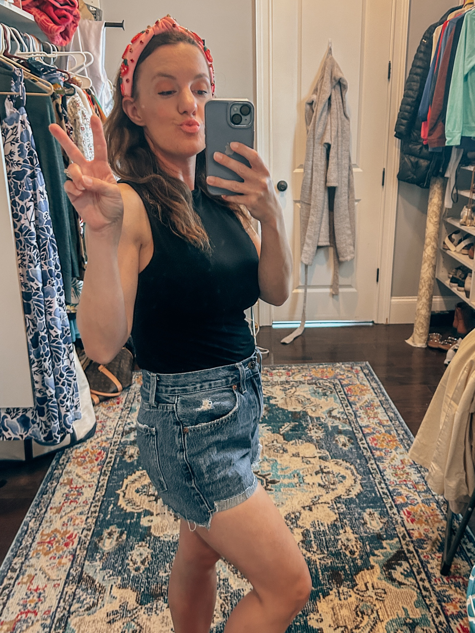 Strawberry picking outfit for mom 
Black tank with high neck 
Dark jean shorts 
Tan sandals 
Thematic strawberry headband 

#LTKfamily #LTKstyletip #LTKSeasonal