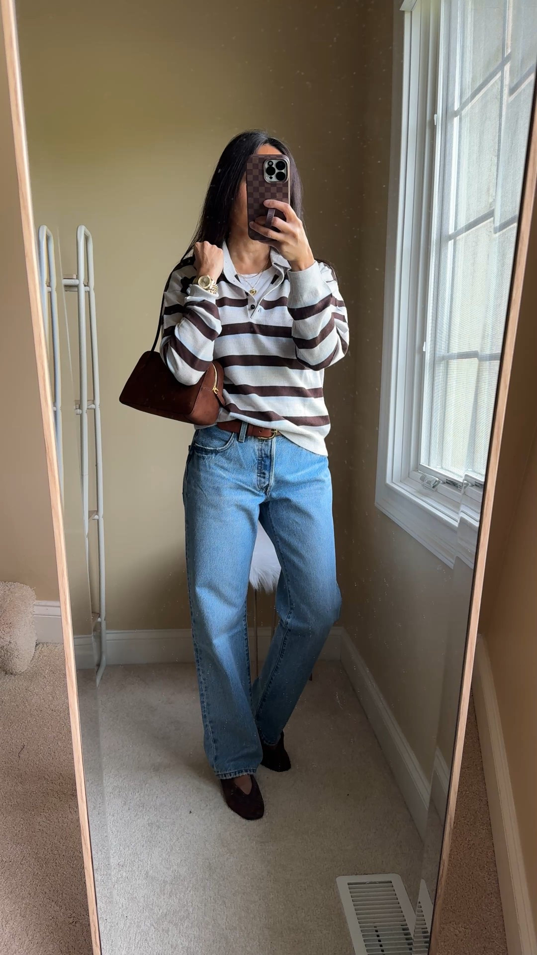 Classic Fall outfit: striped polo & jeans. 
- This exact polo is a sweater done in merino wool. Feels luxe and can be worn alone or layered. I sized up for a relaxed fit. It has been a popular one and has been restocking periodically  
- Straight leg 90s jeans always work. I size up in my favorite true 100% cotton denim style. 
- Suede handbag. Trying out a non crossbody style to change things up and this one is easy to carry on the shoulder or arm. 
- Suede flats in chocolate brown. Linking a variety of options for the look. 
- Classic everyday gold necklaces and cuff bracelet  


#LTKOver40 #LTKStyleTip #LTKFindsUnder100
