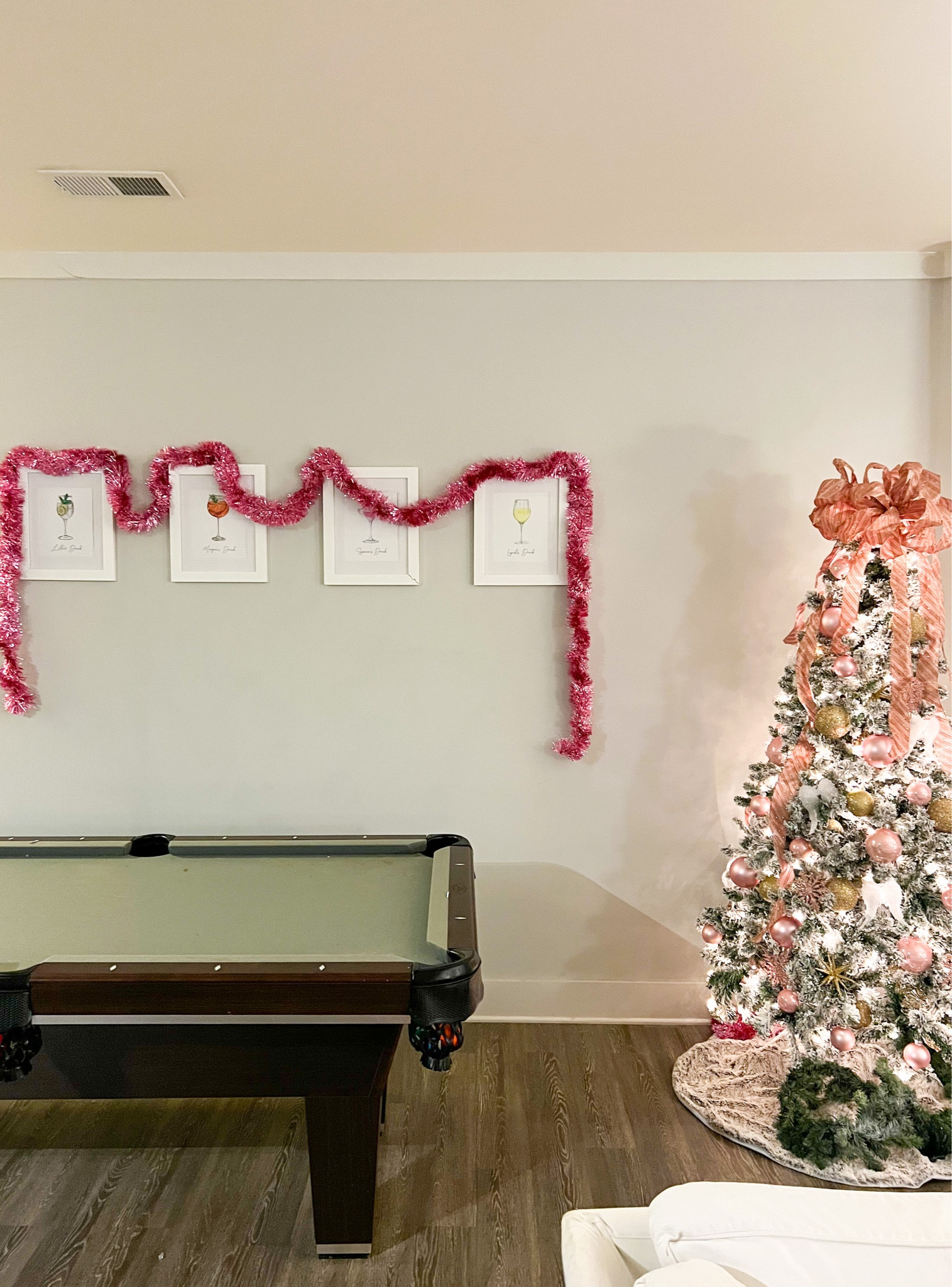 We had a empty wall we wanted to fill in our apartment behind our pool table, so I found custom watercolor prints with our favorite drinks and names on them! This would be a perfect gift to give to your best friends. For each holiday we decorate the empty space around them, so for Christmas we used pink tinsel! #college #cocktails #winelover #customartwork #holiday #personalize

#LTKSeasonal #LTKHoliday