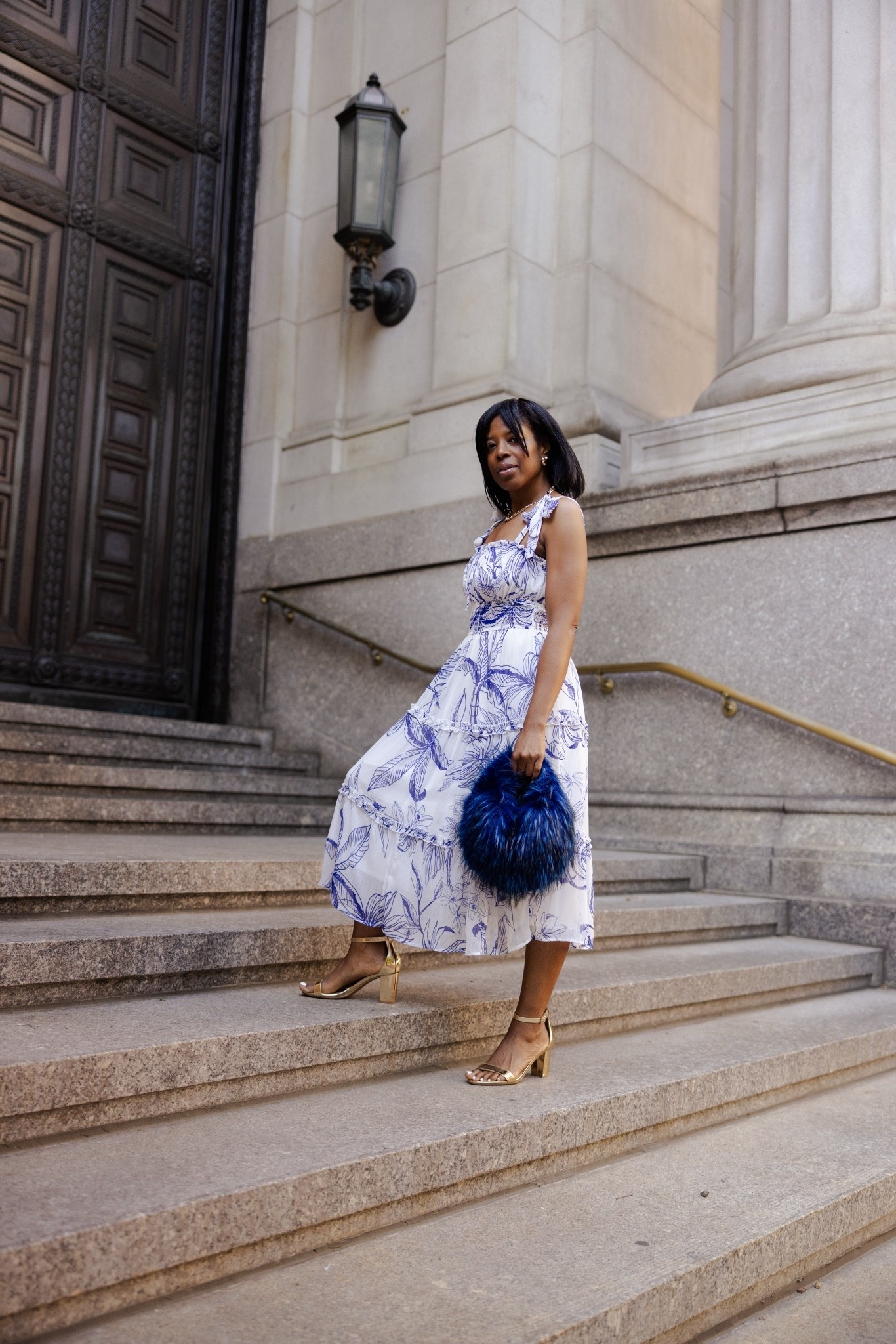 This look felt like something straight out of a fashion travel editorial. The flowy blue and white dress, gold heels, and furry blue bag gave the whole outfit such a bold but feminine feel without doing too much. Definitely one of my favorite street style moments from this shoot and the kind of look that makes everyday feel a little more elevated. Linking the outfit details here.

#LTKootd #LTKSeasonal #LTKTravel