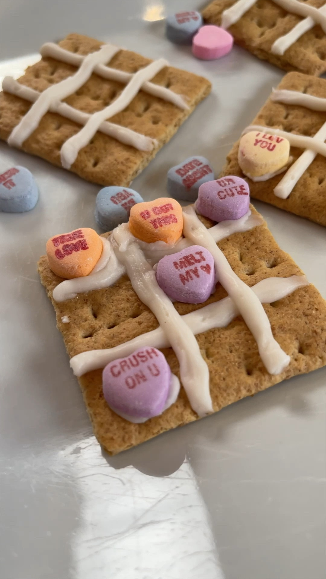 These Tic-Tac-Toe Graham Crackers are so cute + fun for Valentine’s Day!  They are super easy to make and will be a hit with the kids for sure.  You can easily pack these up for a fun lunchbox surprise or make these for a party!  #valentinesdaysnacks #valentinesdaytreats #valentinesdayparty

#LTKSeasonal #LTKparties #LTKfamily