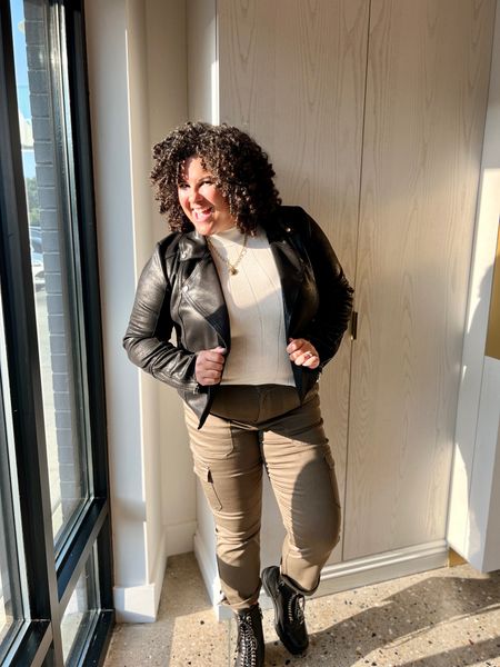 Going for that biker chic look with a black moto jacket over a sleeveless mock neck sweater tank, cuffed cargos, and elevated combat boots.

The pants are super stretchy and the jacket has built in stretch too!

#LTKover40 #LTKmidsize #LTKstyletip