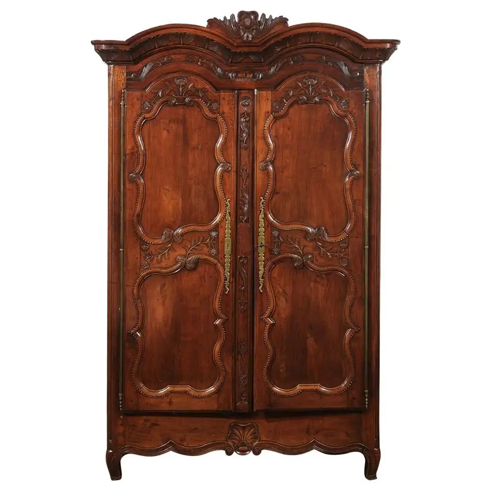French Early 19th Century Cherry Armoire from Rennes Brittany with Carved Motifs | 1stDibs