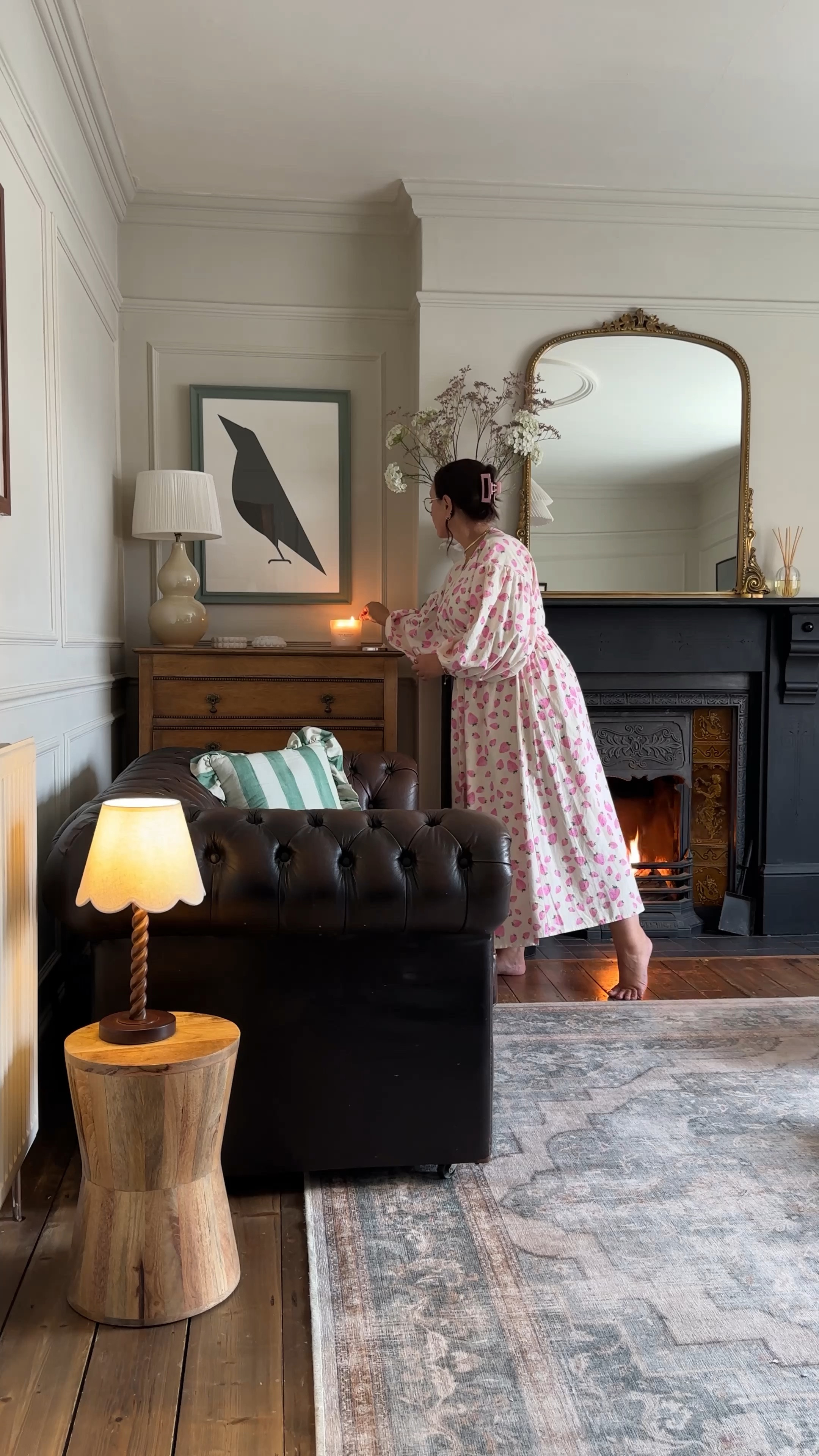 Traditional period living room with leather sofa, open fire and large gold over mantle mirror. 

#LTKhome #LTKeurope