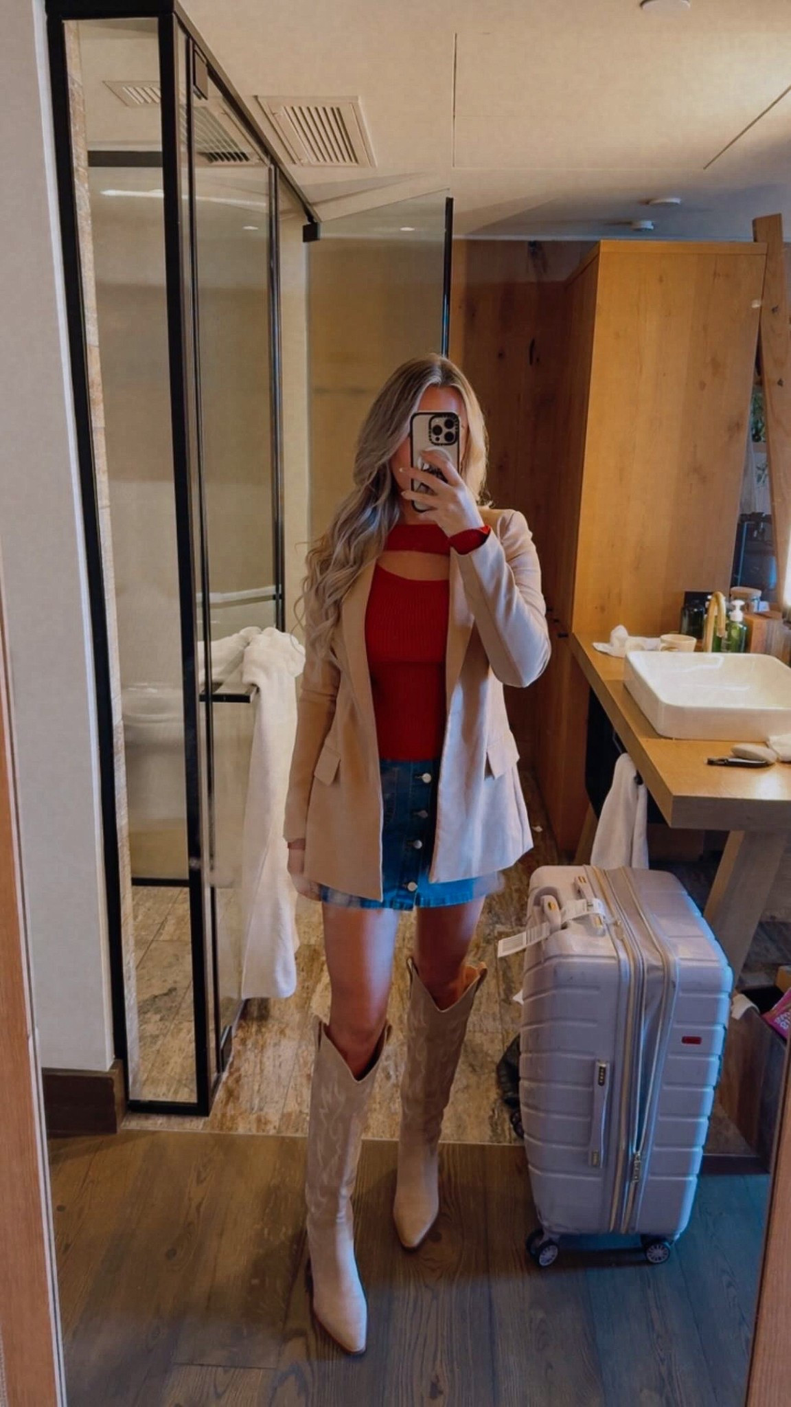 Such a good fall outfit — simple but so cute in person. I wore this in Nashville and everything was comfortable all day.

Sweater: Size small, tucked into the skirt.
Skirt: True to size — wearing a xsmall. No built-in shorts so I added my own.
Boots: Size up ½ size. Super comfortable for walking.
Blazer: Runs big — I’m in a xsmall. This brand of blazer is truly my favorite… the only ones I own in multiple colors.

fall outfit. nashville outfit. girls trip outfit. fall sweater outfit. red sweater outfit. mini skirt outfit. denim skirt outfit. cowboy boots outfit. western boots outfit. blazer outfit. fall layers. comfy walking boots. casual date outfit. fall weekend outfit. thanksgiving outfit ideas. Nashville outfit. trending outfits. fall style.

#LTKFindsUnder50 #LTKootd