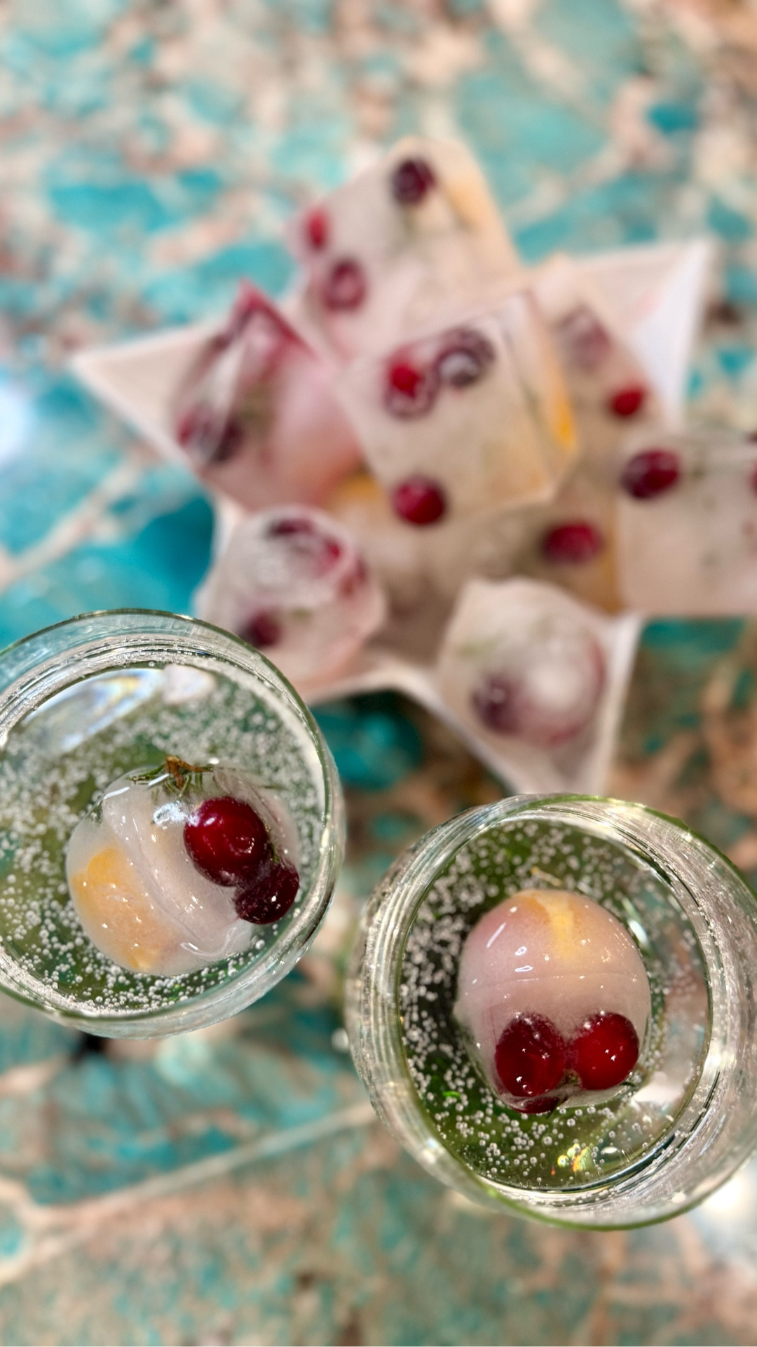 The holidays are my favorite time of year. There are always tons of parties, and any excuse to get dressed up is always a yes for me. These festive ice cubes are perfect to add to sparkling water or cocktails and if you’re hosting a holiday party this season, these are easy and quick to make and definitely make any beverage more fun

Ingredients -
Frozen cranberries 
Orange slices 
Rosemary sprigs
Ice cube trays (linked)
Pretty glassware (mine are vintage)

Instructions-
1. Slice oranges into small cubed pieces
2. Cut small rosemary sprigs into 1” pieces 
3. Place orange slices, cranberries, and rosemary sprigs into each ice tray.
4. Fill with water and freeze overnight
5. Pop out of silicone into glassware and add sparkling water or your favorite holiday cocktail


#LTKHoliday #LTKFindsUnder50 #LTKSeasonal