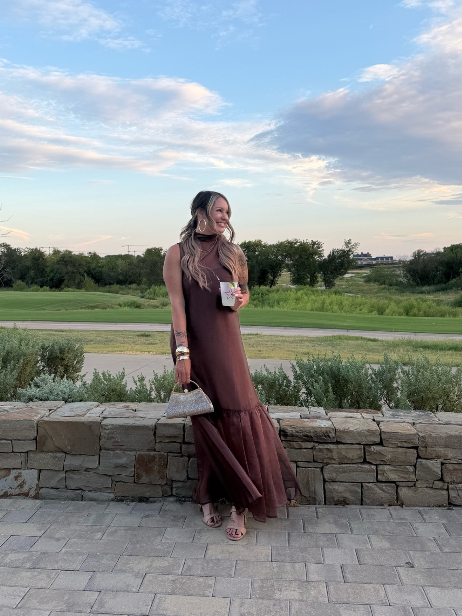 LOVED this dress at LTK Con. It has a shorter under dress with this sheer overlay and ruffle at the bottom. The back has a bow to tie around your neck as well. It was so comfortable in the Texas heat. I washed it and wore again last night to a wedding where it was 100 degrees in Oklahoma and I wasn’t too hot! Highly recommend as a cocktail or wedding guest dress. Paired with affordable nude heels and gold bangles from Target! Fall fashion.

#LTKMidsize #LTKCon #LTKWedding
