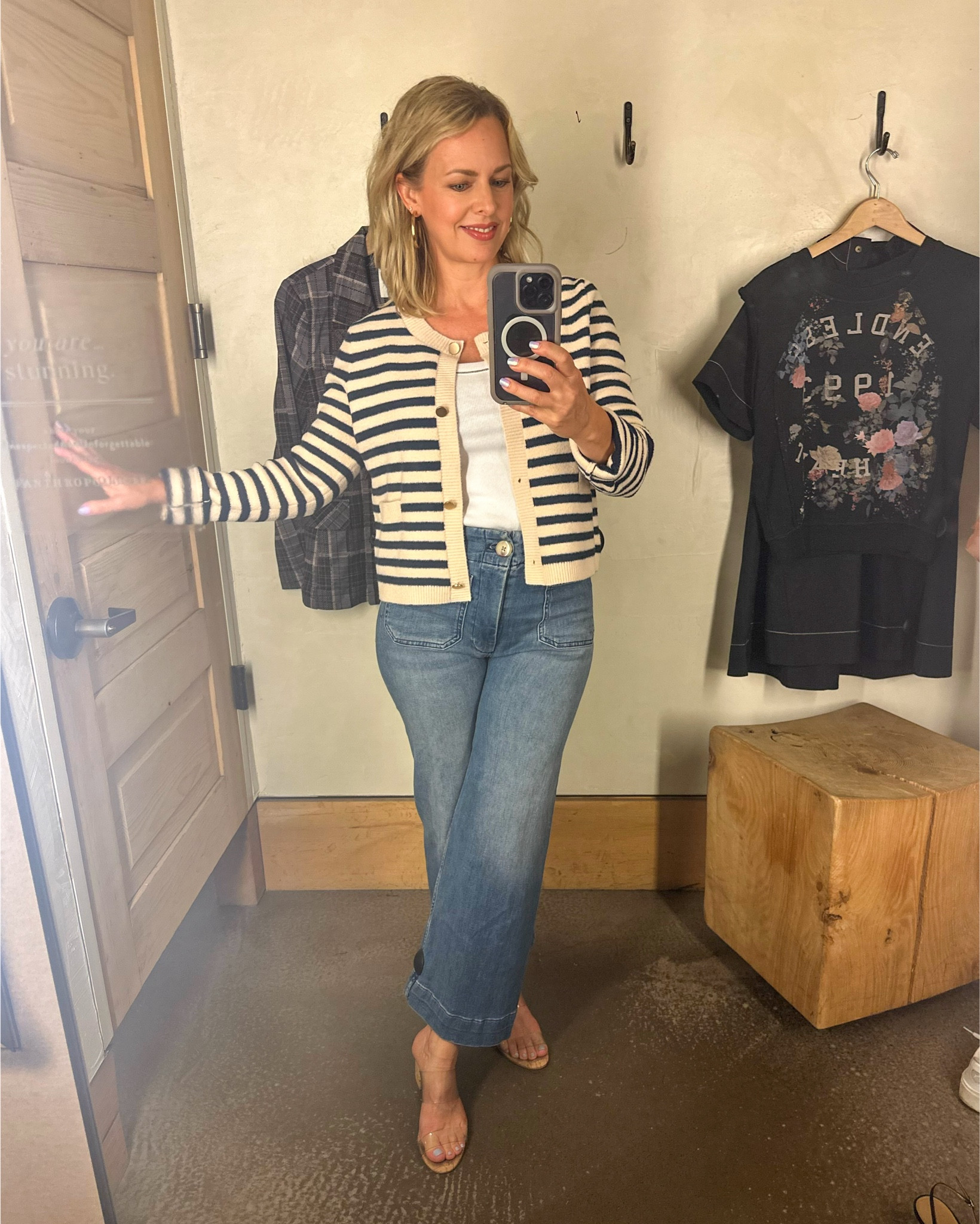 They call it a striped “coatigan” sweater at Anthro. I tried it in navy stripe but it’s so new it’s not available online in the navy. The RED stripe is online, however and just as great, of course! 
I really like the soft gold matte buttons and the shape, length of this topper you can wear as your shirt for the day or open up and layer over your dresses, tank tops, etc.
I’m wearing a small and it’s perfect. The jeans are the ever-popular Colette in a medium wash. So SOFT! I’m wearing a 27 Reg in the jeans, true to size. I’m 5 foot four. The Colette style comes in regular, tall, plus and petite and 16 different color/fabric options. 

#LTKWorkwear #LTKOver40 #LTKStyleTip