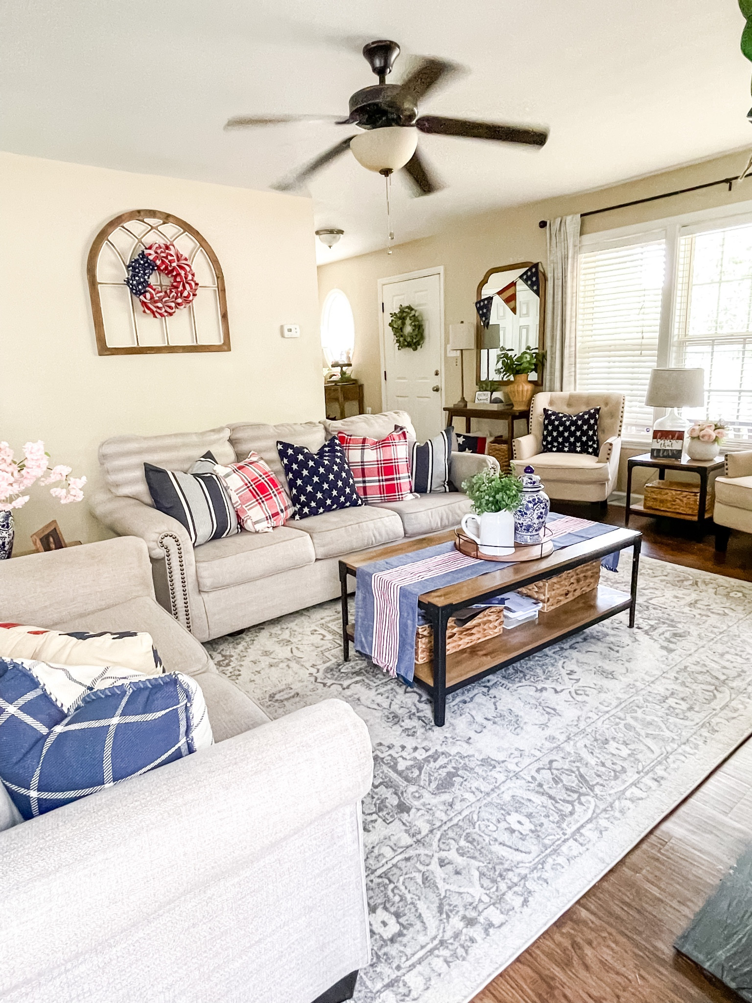 Americana living room decor. Flag wreath. Blue star pillows. Coffee table. Area rug  

#LTKFind #LTKhome #LTKSeasonal