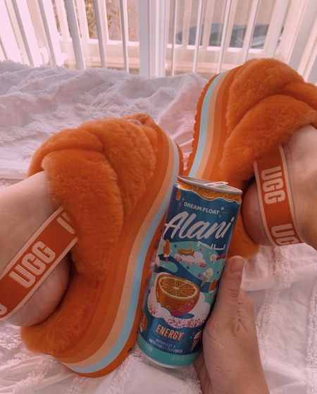 rest day essentials 🤍

the uggs are sold out but i linked similar styles! they’re the disco knot slides in mandarin orange 🍊
+ dream float is truly the best alani nu flavor ☁️🫧

shop these finds & so much more on my LTK! @kamavacap ☁️🫧✨

#LTKFind #LTKstyletip #LTKfit