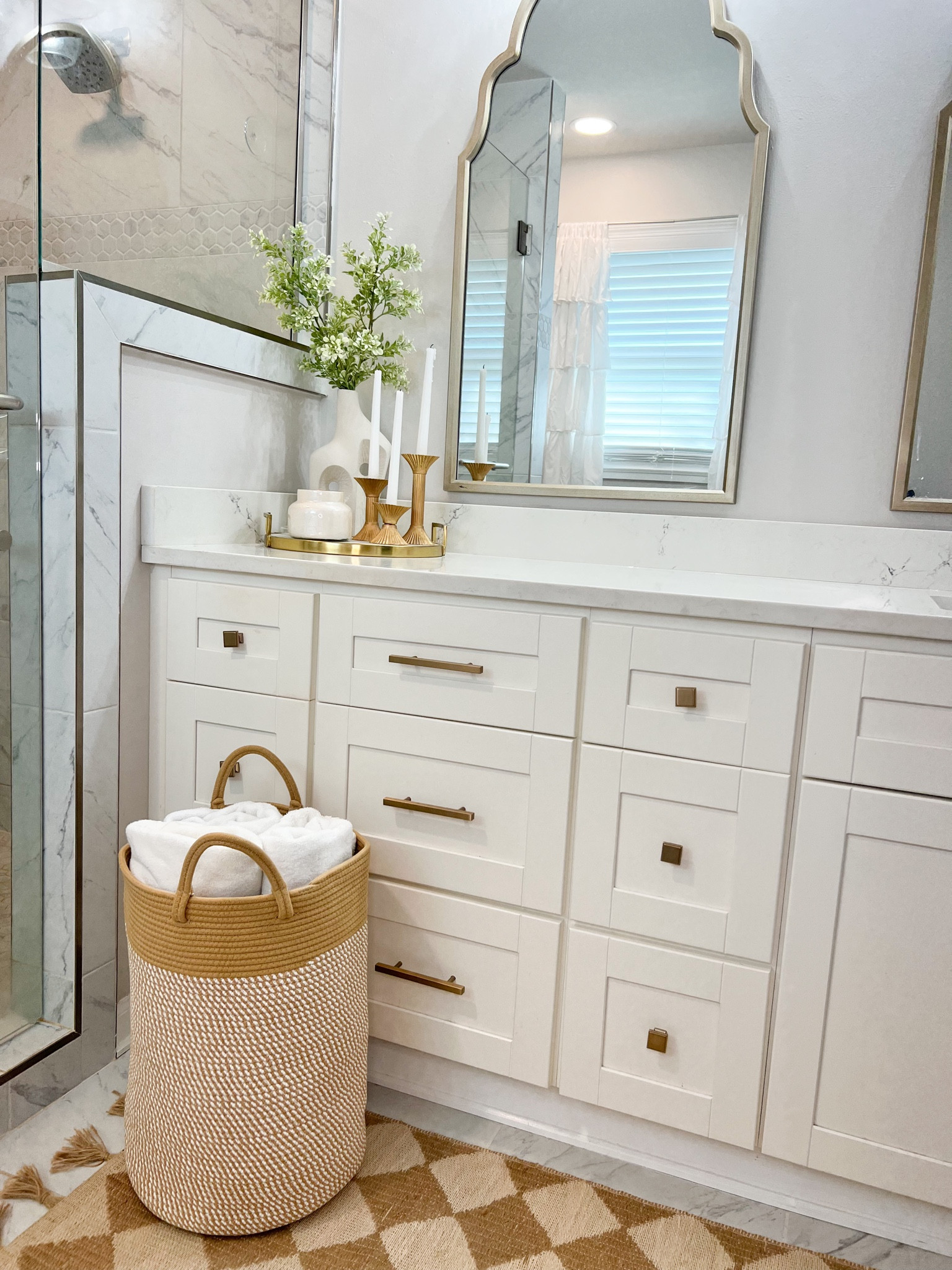 Bathroom styling, new oversized woven basket, towel storage, master bathroom, tile, marble, mirror, sconce, cabinet hardware 

#LTKunder50 #LTKsalealert #LTKhome