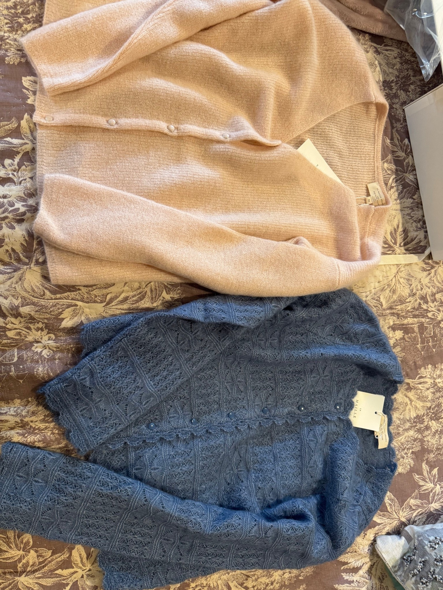 Gorgeous sweaters from sezane. The pink one you can wear the buttons in the front or back. I got an extra small. It comes in a ton of colors.  the blue lace one definitely size up. I am wearing a medium that also comes in a few other colors.

#LTKGiftGuide #LTKSeasonal #LTKOver40