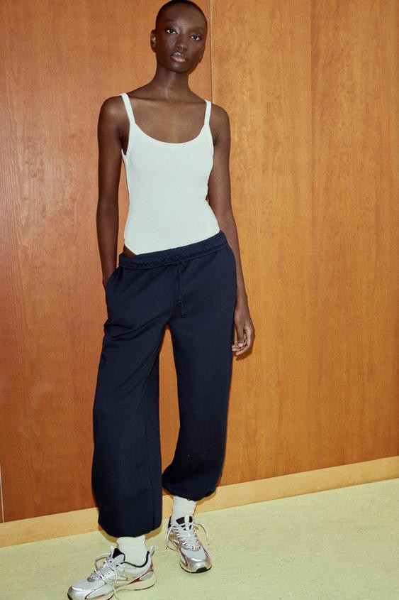 Running style sneakers. Contrasting details on the body and a combination of materials. Back pull... | Zara US