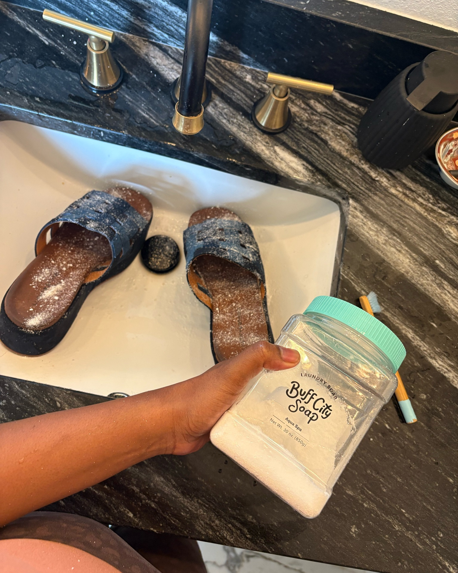 I’m not afraid to thrift for shoes because I know what to look for and I know a good system to clean and sanitize them!

Some shoes I can throw in the washing machine, but some things need to be hand washed and treated very delicately so that the dye doesn’t run or the shoes don’t get mildewed.

Ask me how I know!

For these sandals, I first sprayed them with stain remover as the soles were pretty grimy. 

Then I sprinkled them with borax and followed it up with a scrubbing with my favorite buff city soap laundry detergent.

Now, they are currently laying in the sun to dry, and when that is finished, will get put in the shoe drawer! ￼

#LTKdayinmylife #LTKHome