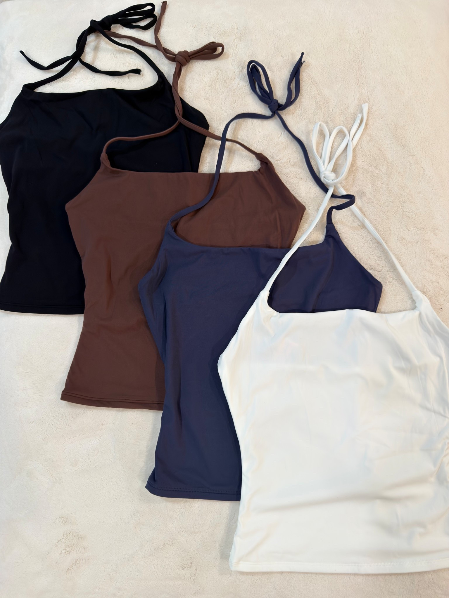Easy elevated basics you’ll reach for on repeat. These halter tops are the kind of versatile staple that works layered or worn solo, and they’re perfect for building outfits across seasons. I love how they style effortlessly with denim, trousers, or under a blazer — cost per wear drops fast with pieces like this.

Perfect for casual days, travel outfits, layering for work looks, or dressed-up dinners.

📏 Sizing & fit details:  
• Halter top: Size Small  
• Measurements: 5'4" | 34D bust | 27" waist | 40" hips  
• Denim pairing reference: 27 Long or 4 Long  
• For a baggier look with cargos or sweats, size up to Medium

Tap to get details and see all color options.

Follow me on Instagram and YouTube @kirasfashionfinds