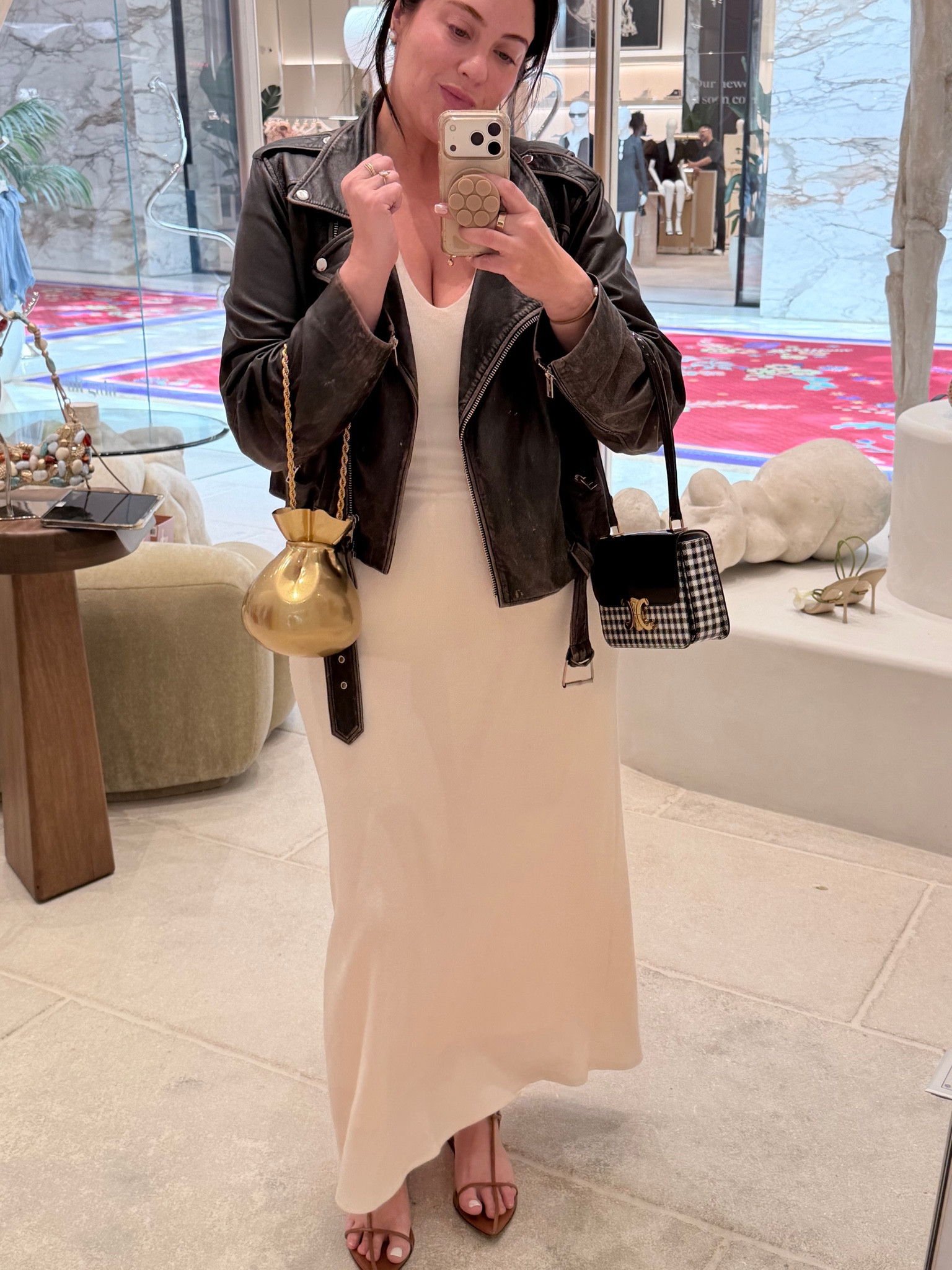 Jacket is old but the best. Invest in distressed leather. Bag is rented from Vivrelle. Dress is very comfortable. 