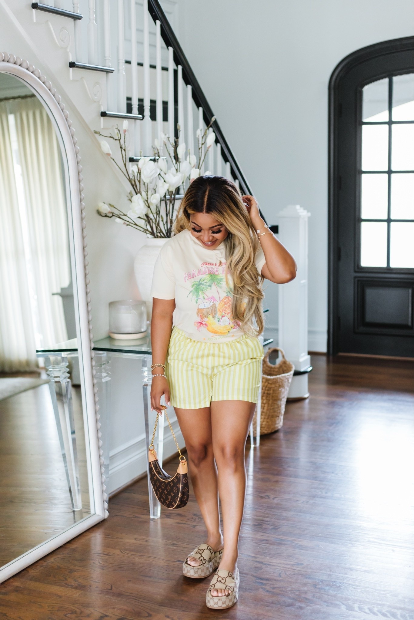 The cutest little summer outfit. 💛 The tropical graphic tee and striped shorts are such a fun combo for summer. Easy, comfortable, and perfect for everything from running errands to chasing the kids around.

summer outfit // casual mom outfit // graphic tee // striped shorts // everyday style // vacation outfit // resort wear // comfy summer look // effortless style // mom fashion // summer fashion // weekend outfit