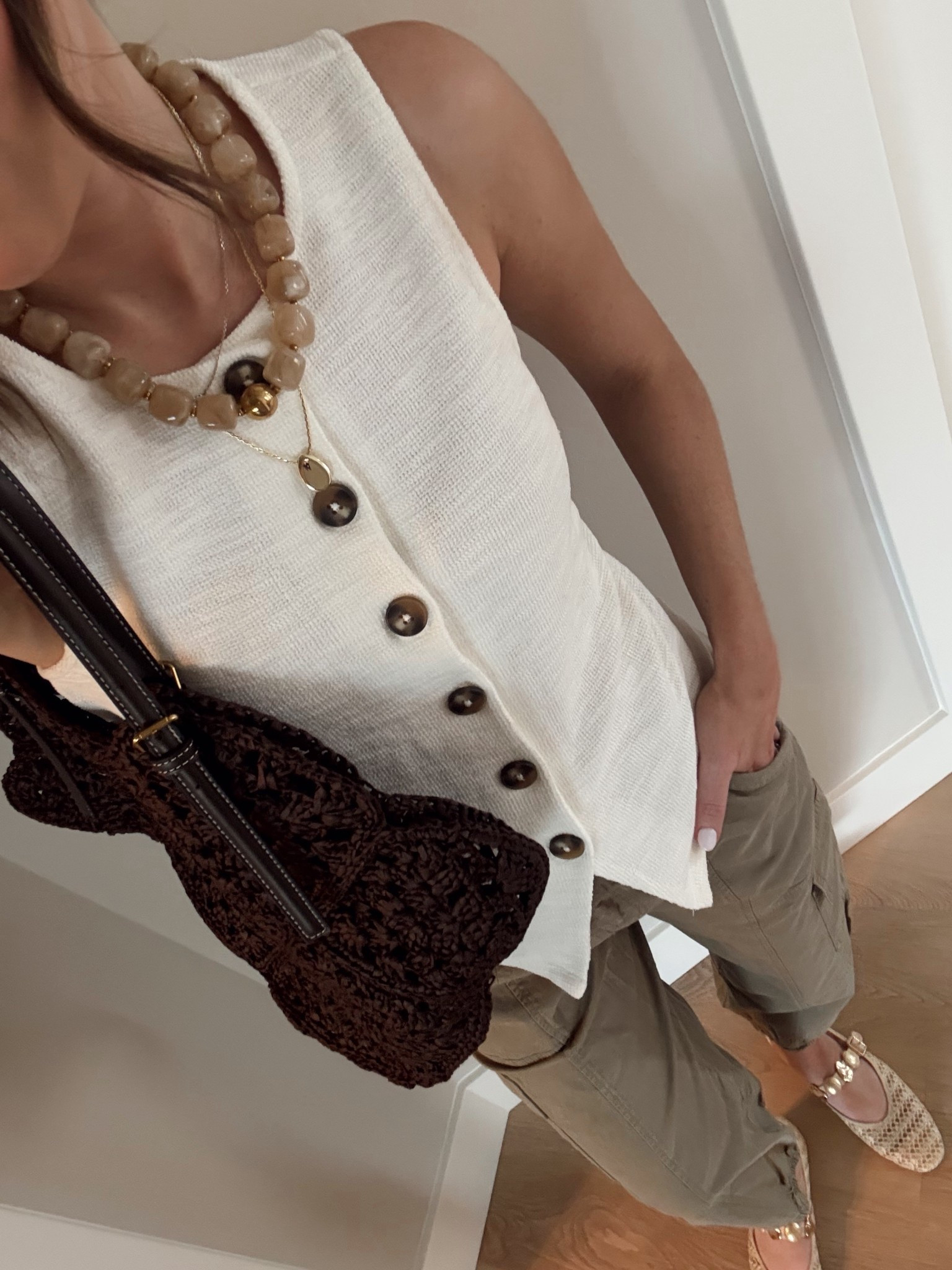 Spring ootd🌼 a knit vest and cargo joggers for a cute and casual combo. I am obsessed with these ballet flats too! 

OOTD, knit top, casual style, what I’m wearing, style over 30, beaded necklace, dolce vita, green cargo pants 

#LTKootd