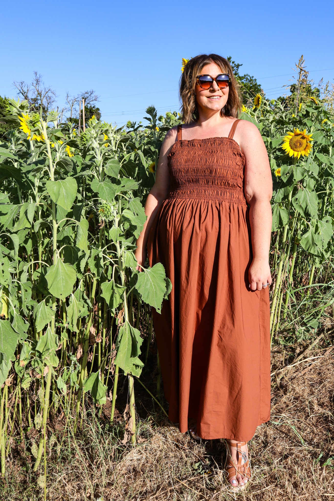 The most perfect summer to fall transition dress and it’s on major sale! This plus size dress has a fully smocked top so it’s super comfortable and will be easy to layer with a denim jacket or cardigan. Jen is wearing a 14/16. 

#LTKPlusSize #LTKOver40 #LTKSaleAlert
