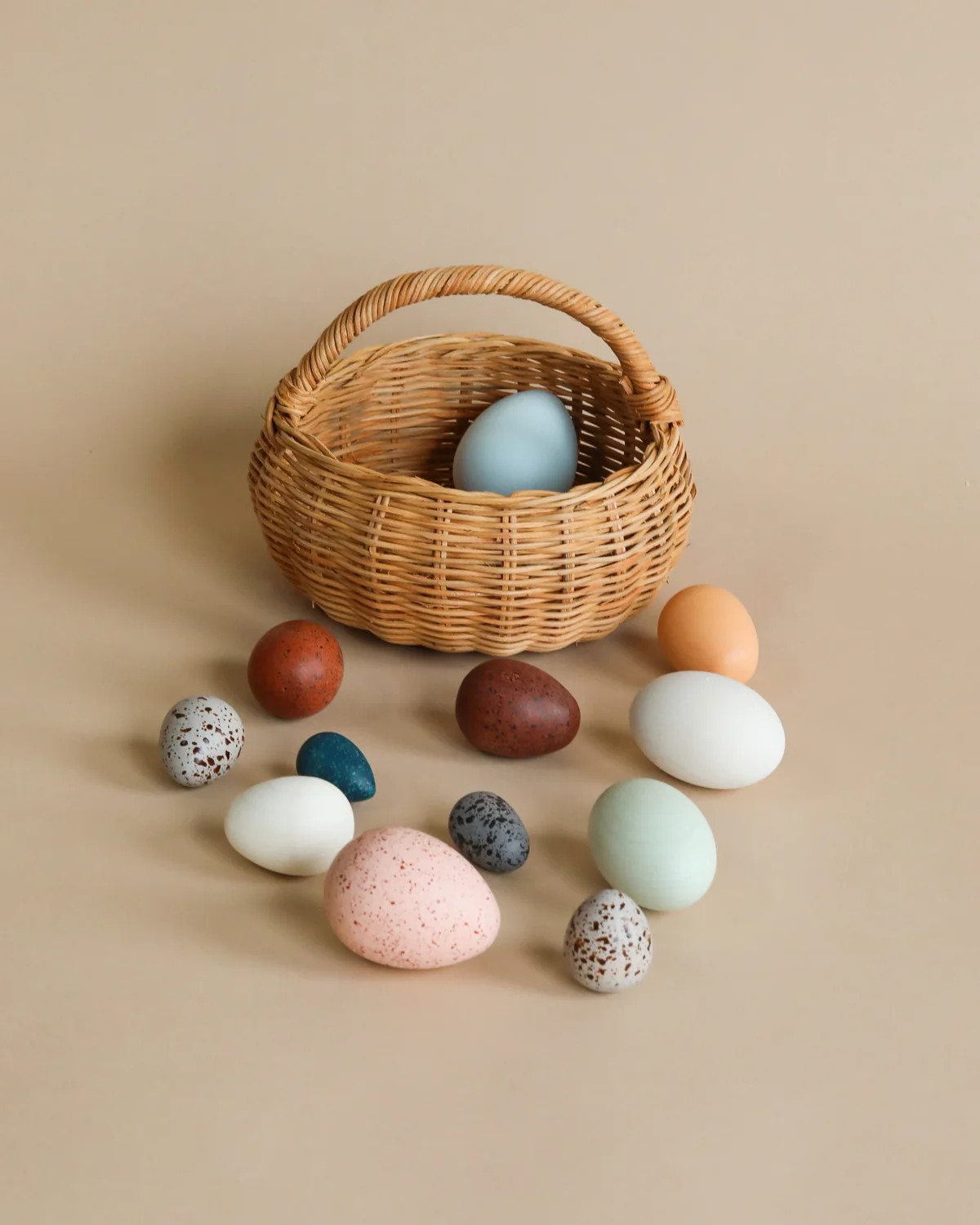 A Dozen Wooden Bird Eggs In A Basket | Odin Parker