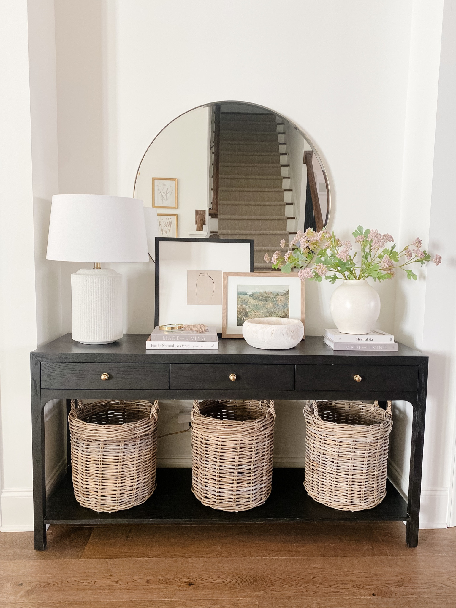 Spring entryway. Entryway console. Spring decor. Neutral decor. Transitional decor. Baskets. Table lamp. Florals. Art

#LTKhome